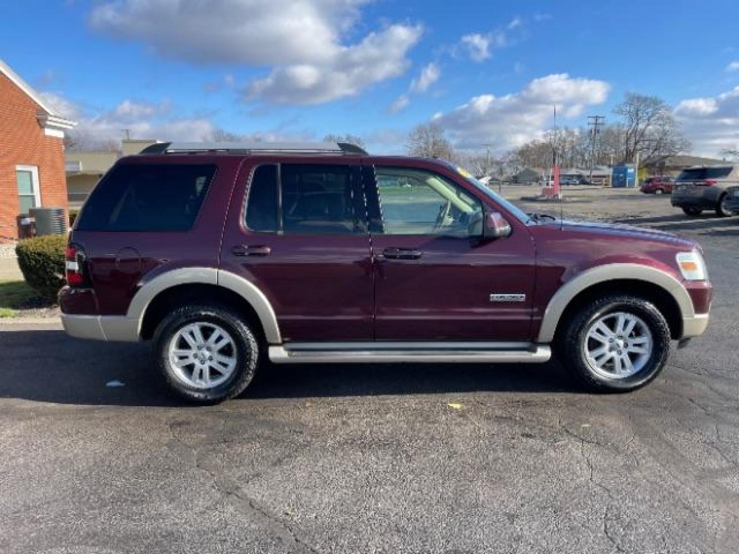 2007 Dark Cherry Metallic Ford Explorer Eddie Bauer 4.0L 4WD (1FMEU74E77U) with an 4.0L V6 SOHC 16V engine, 5-Speed Automatic transmission, located at 4508 South Dixie Dr, Moraine, OH, 45439, (937) 908-9800, 39.689976, -84.218452 - Photo#4