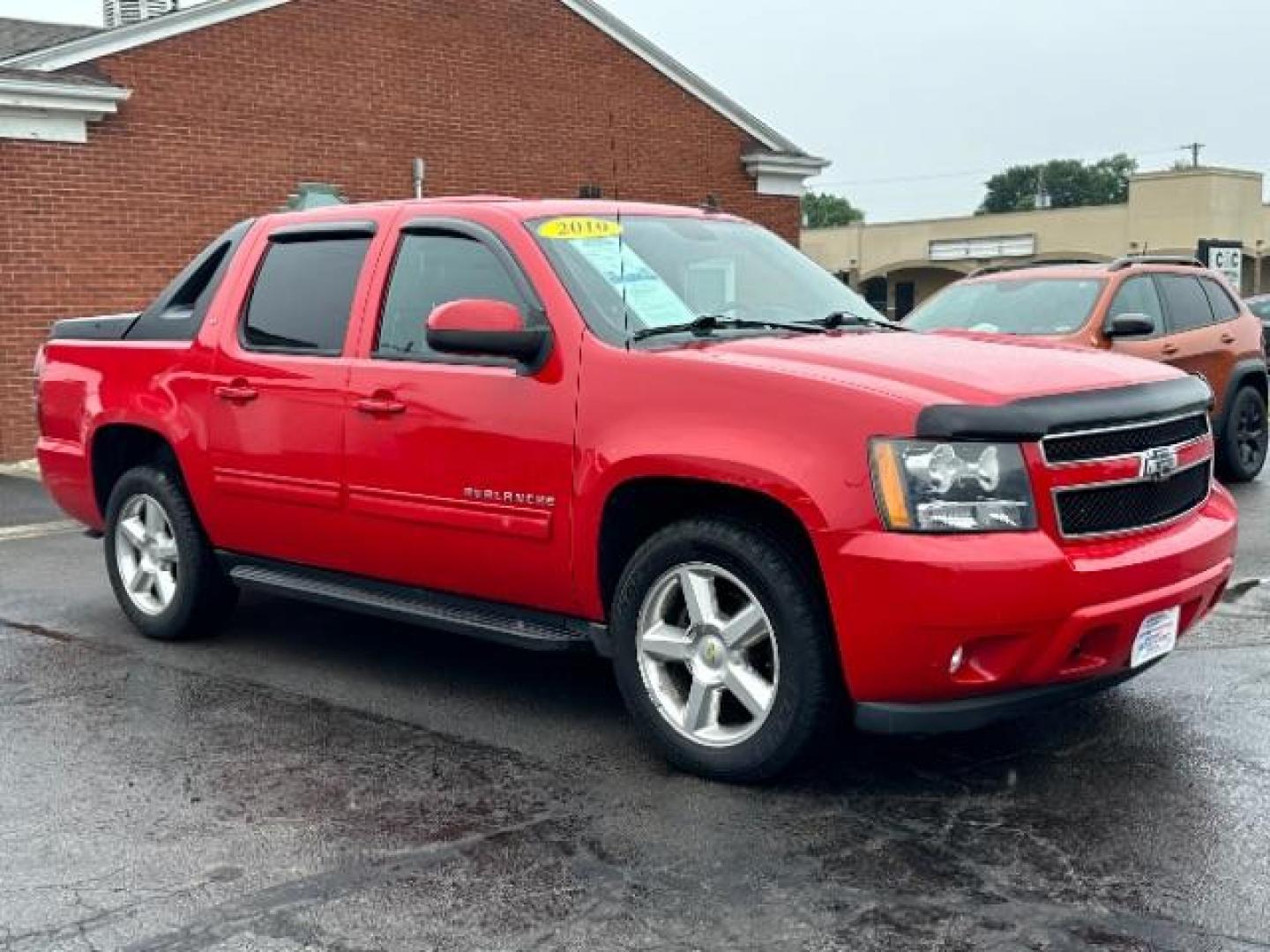 2010 Victory Red Chevrolet Avalanche LT 4WD (3GNVKFE09AG) with an 5.3L V8 OHV 16V FFV engine, 4-Speed Automatic transmission, located at 880 E. National Road, Vandalia, OH, 45377, (937) 908-9800, 39.891918, -84.183594 - Photo#0