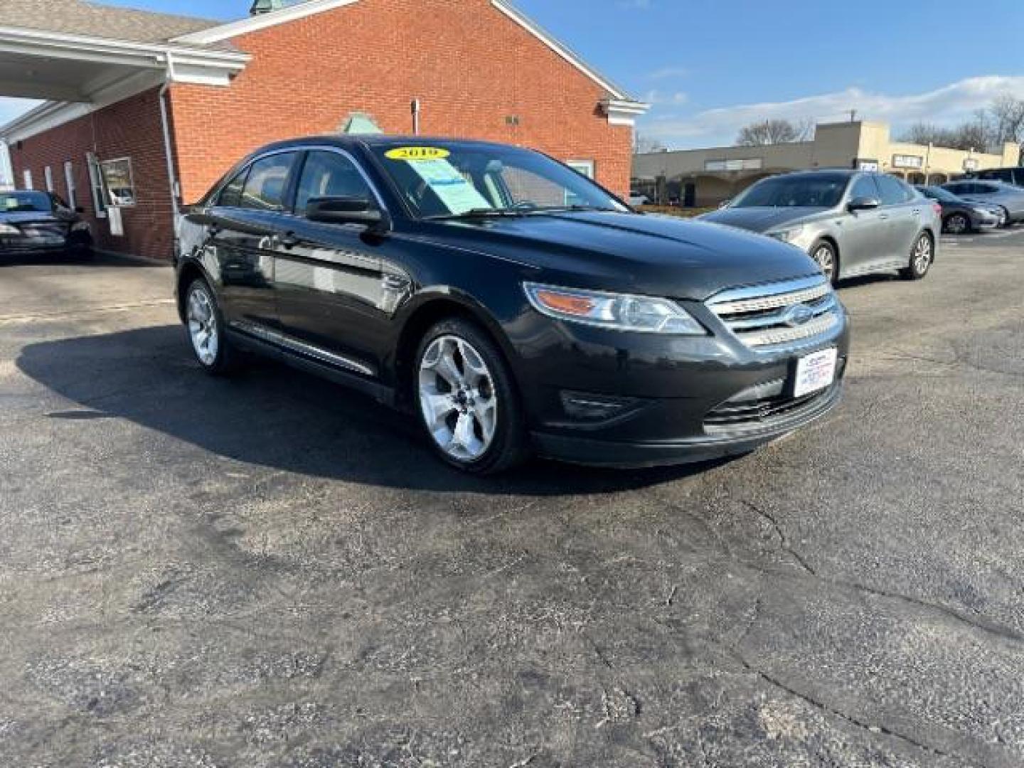 2010 Tuxedo Black Metallic Ford Taurus SEL FWD (1FAHP2EW5AG) with an 3.5L V6 DOHC 24V engine, 6-Speed Automatic transmission, located at 1099 N County Rd 25A, Troy, OH, 45373, (937) 908-9800, 40.057079, -84.212883 - Photo#0