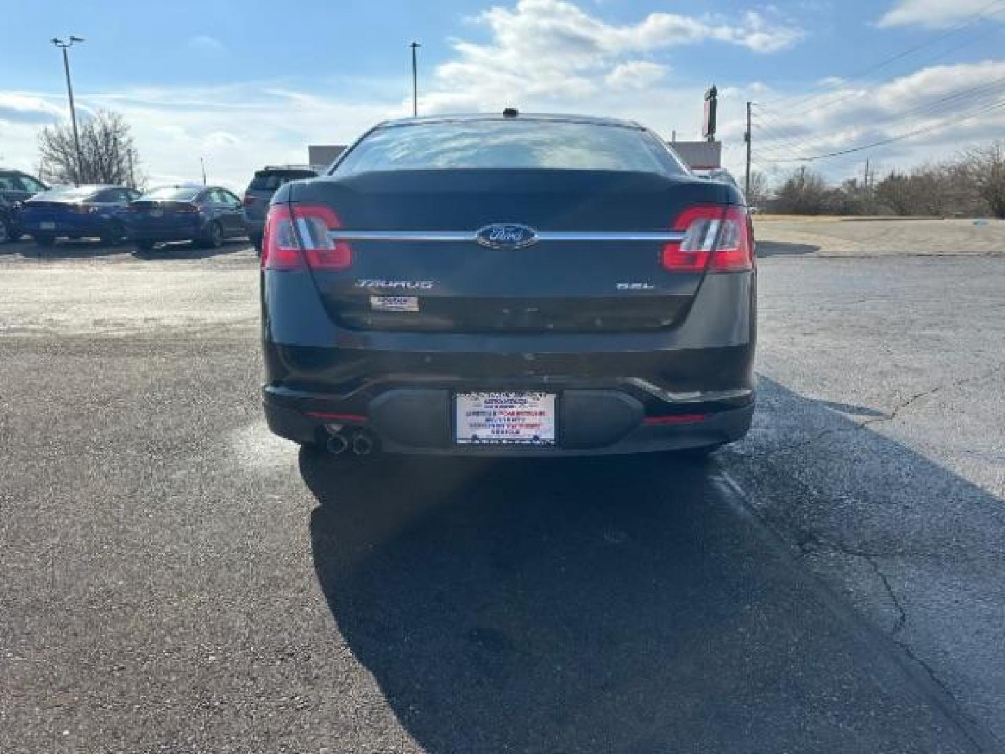 2010 Tuxedo Black Metallic Ford Taurus SEL FWD (1FAHP2EW5AG) with an 3.5L V6 DOHC 24V engine, 6-Speed Automatic transmission, located at 1099 N County Rd 25A, Troy, OH, 45373, (937) 908-9800, 40.057079, -84.212883 - Photo#4