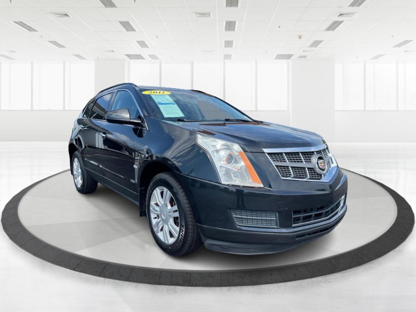 2011 Black Raven Cadillac SRX (3GYFNGEY5BS) with an 3.0L V6 DOHC 24V engine, 6-Speed Automatic transmission, located at 401 Woodman Dr, Riverside, OH, 45431, (937) 908-9800, 39.760899, -84.123421 - Photo#0