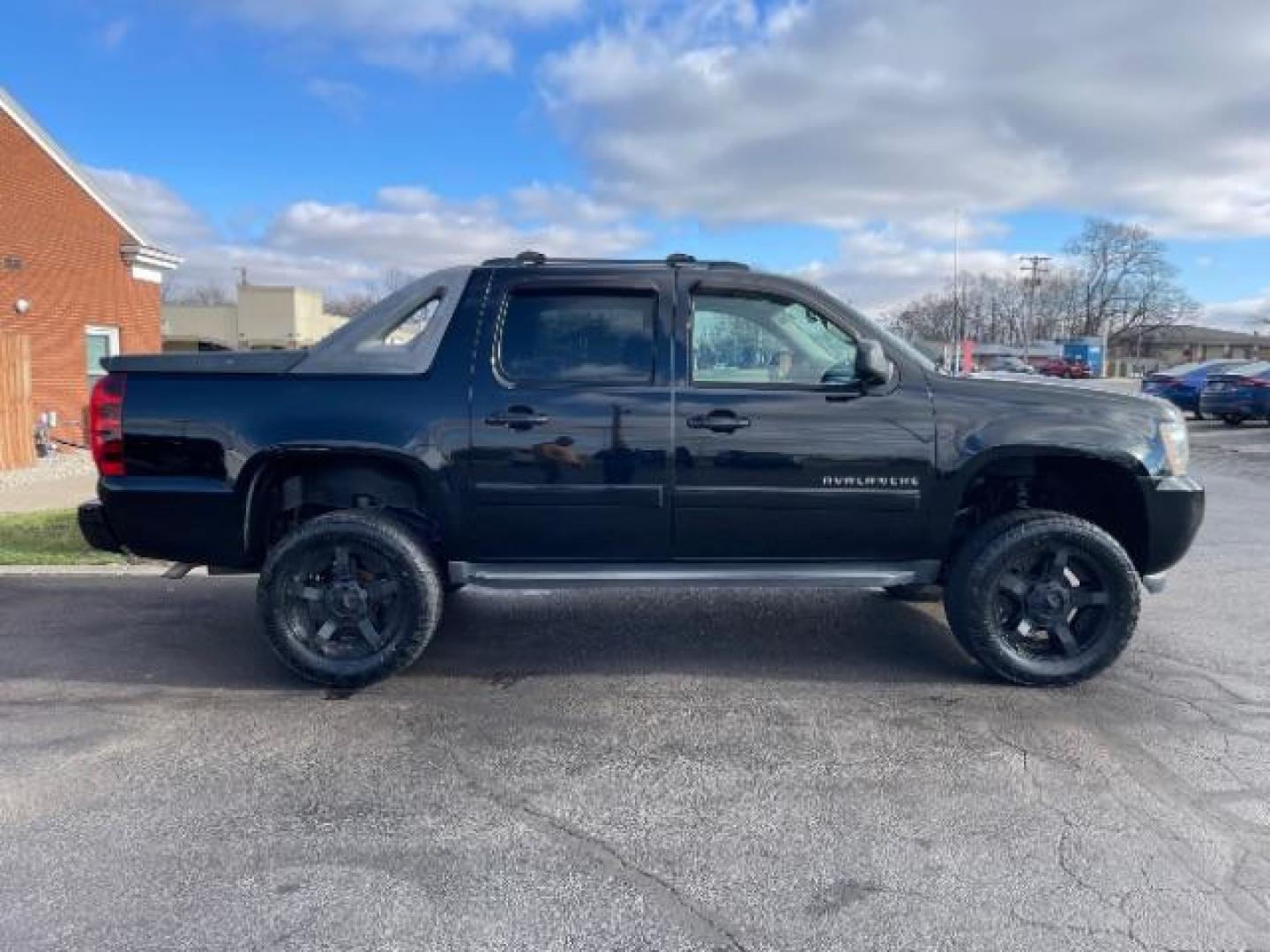 2011 Black Chevrolet Avalanche LTZ 4WD (3GNTKGE30BG) with an 5.3L V8 OHV 16V FFV engine, 4-Speed Automatic transmission, located at 401 Woodman Dr, Riverside, OH, 45431, (937) 908-9800, 39.760899, -84.123421 - Photo#2