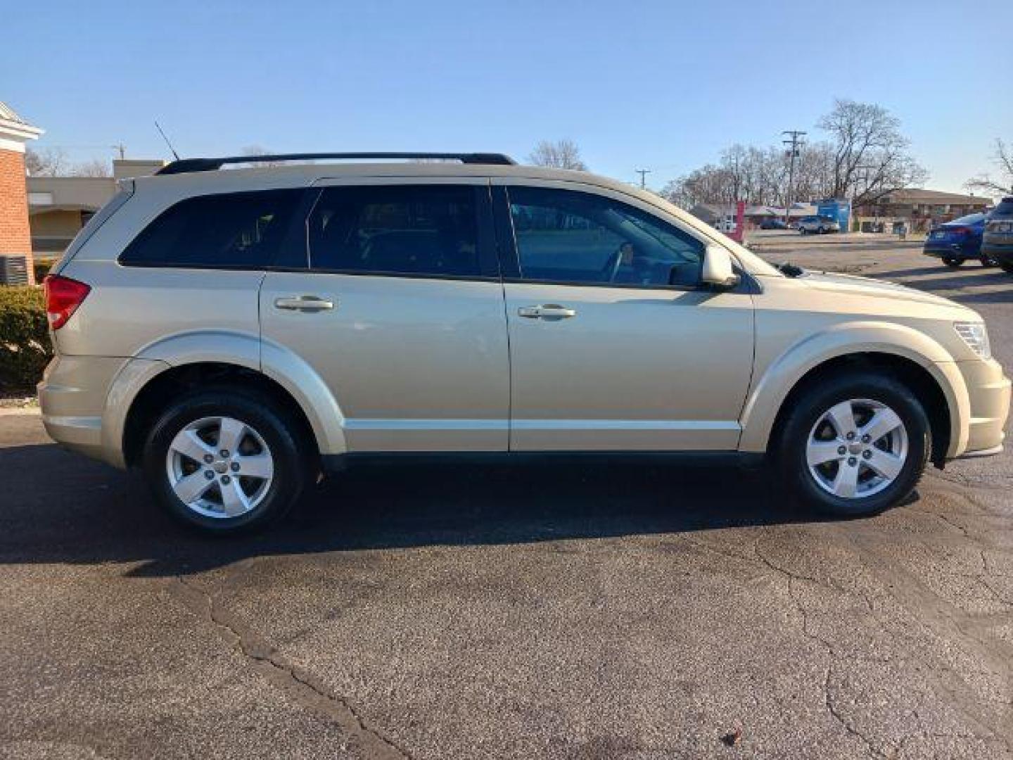 2011 White Gold Dodge Journey Mainstreet (3D4PG1FG9BT) with an 3.6L V6 DOHC 24V engine, 6-Speed Automatic transmission, located at 4508 South Dixie Dr, Moraine, OH, 45439, (937) 908-9800, 39.689976, -84.218452 - Photo#4