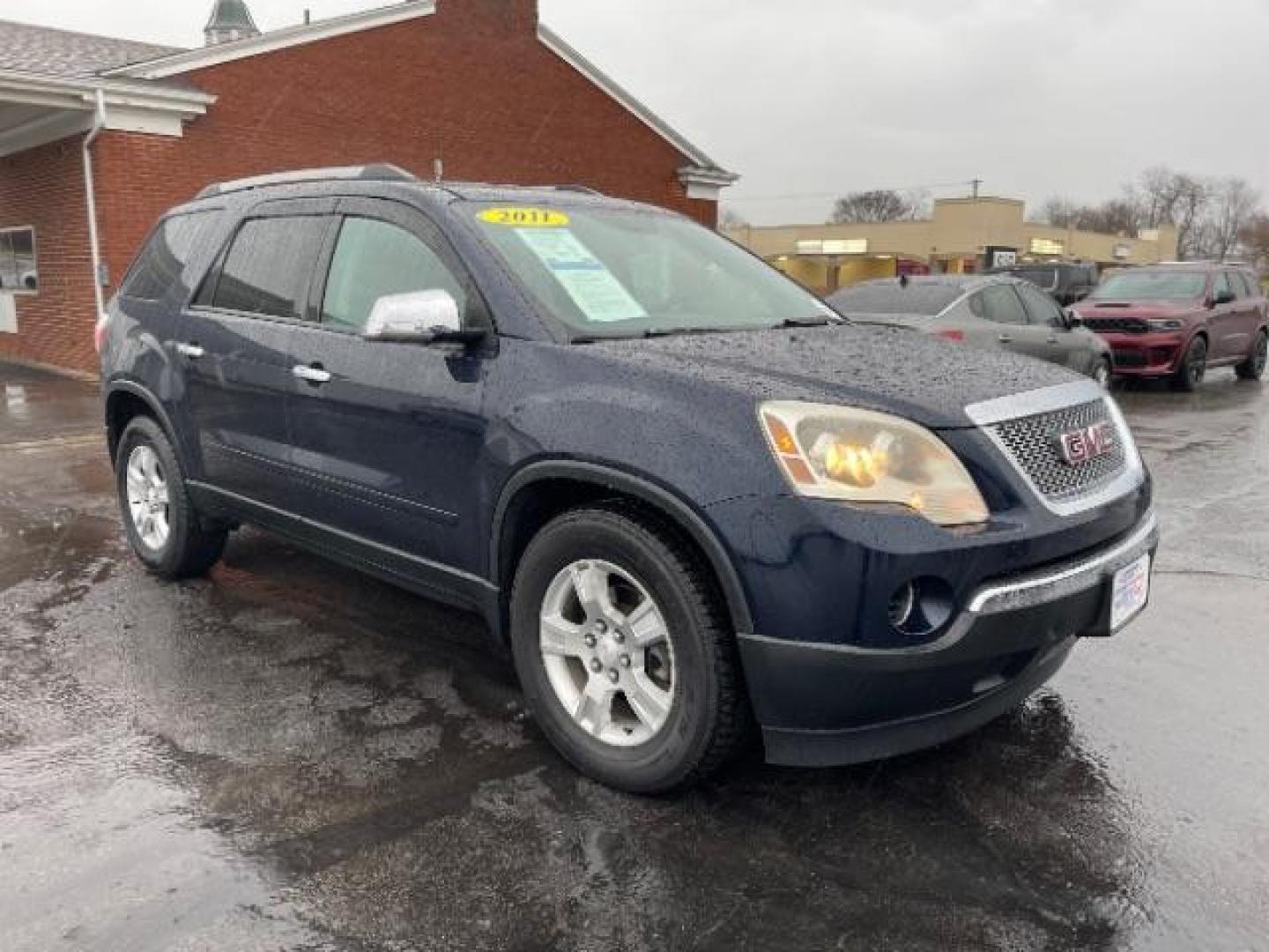 2011 Dark Blue Metallic GMC Acadia SLE-1 AWD (1GKKVNED3BJ) with an 3.6L V6 DOHC 24V engine, 6-Speed Automatic transmission, located at 880 E. National Road, Vandalia, OH, 45377, (937) 908-9800, 39.891918, -84.183594 - Photo#0