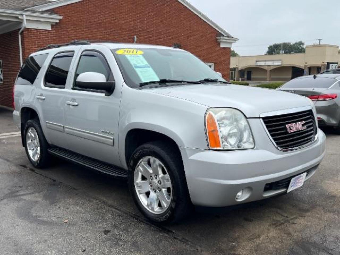 2011 Pure Silver Metallic GMC Yukon SLT1 4WD (1GKS2CE0XBR) with an 5.3L V8 OHV 16V FFV engine, 6-Speed Automatic transmission, located at 401 Woodman Dr, Riverside, OH, 45431, (937) 908-9800, 39.760899, -84.123421 - Third Row - Photo#0