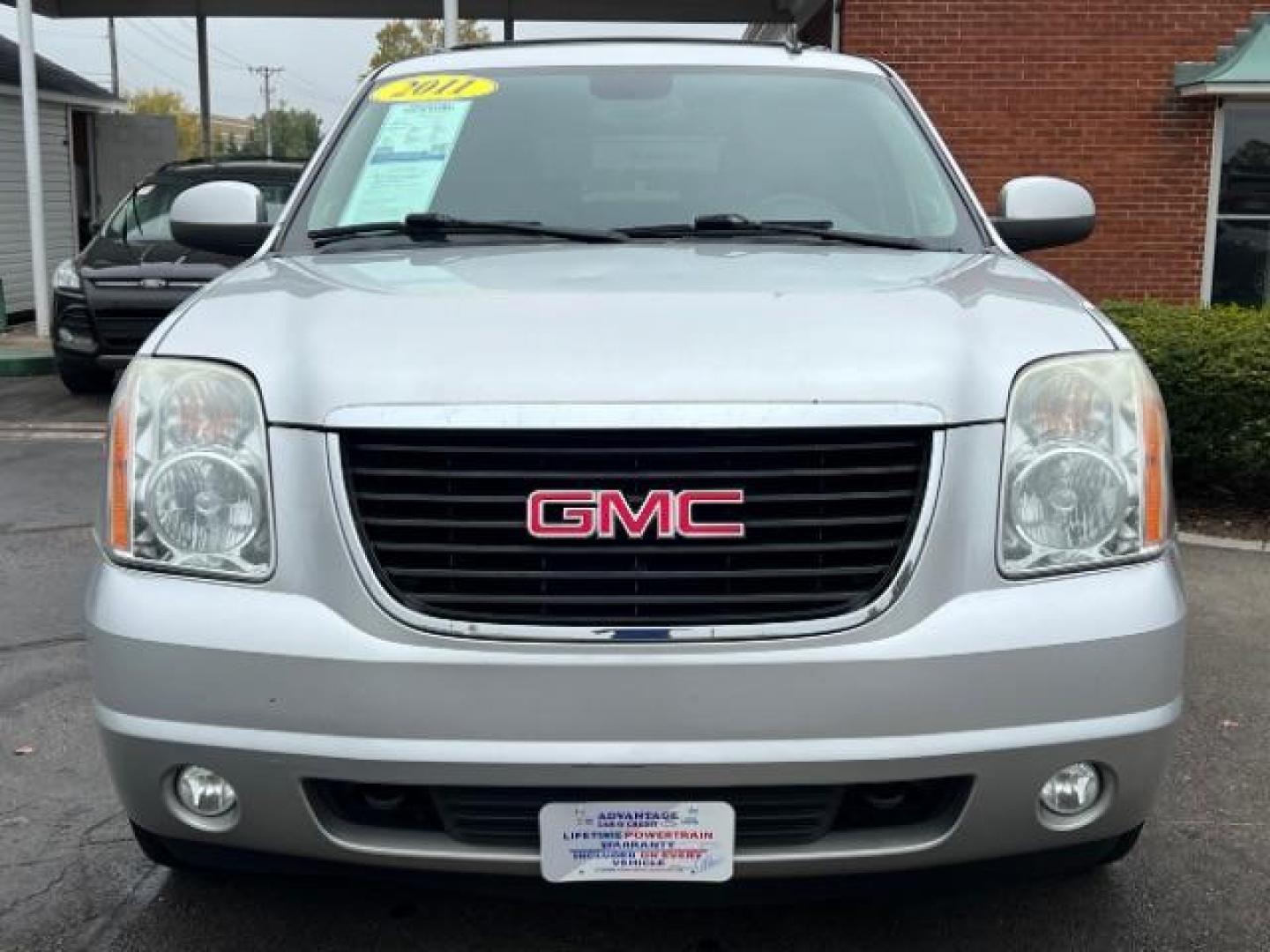 2011 Pure Silver Metallic GMC Yukon SLT1 4WD (1GKS2CE0XBR) with an 5.3L V8 OHV 16V FFV engine, 6-Speed Automatic transmission, located at 401 Woodman Dr, Riverside, OH, 45431, (937) 908-9800, 39.760899, -84.123421 - Third Row - Photo#1