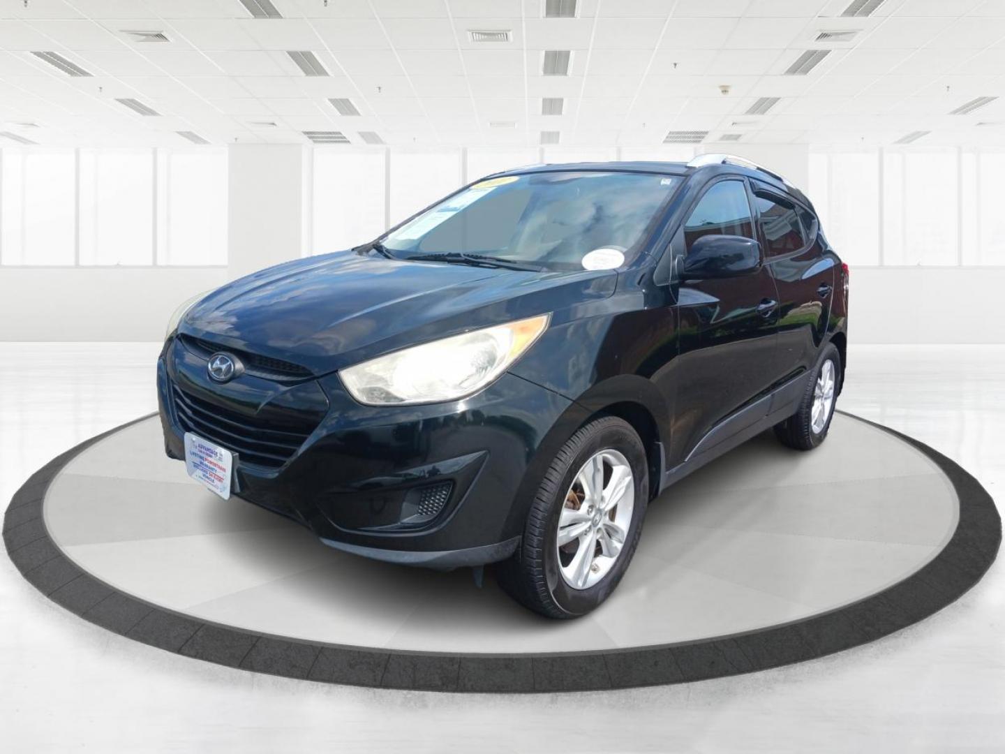 2011 Ash Black Mica Hyundai Tucson (KM8JU3AC8BU) with an 2.4L L4 DOHC 16V engine, 6-Speed Automatic transmission, located at 1099 N County Rd 25A, Troy, OH, 45373, (937) 908-9800, 40.057079, -84.212883 - Photo#5