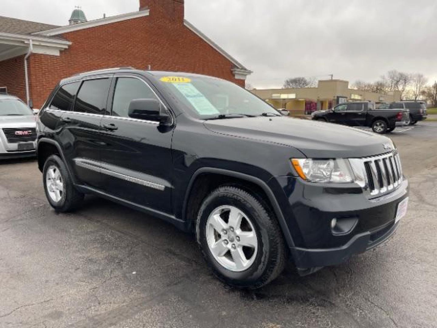 2011 Brilliant Black Crystal Pearl Jeep Grand Cherokee Laredo 4WD (1J4RR4GG4BC) with an 3.6L V6 DOHC 24V engine, 5-Speed Automatic transmission, located at 880 E. National Road, Vandalia, OH, 45377, (937) 908-9800, 39.891918, -84.183594 - Photo#0