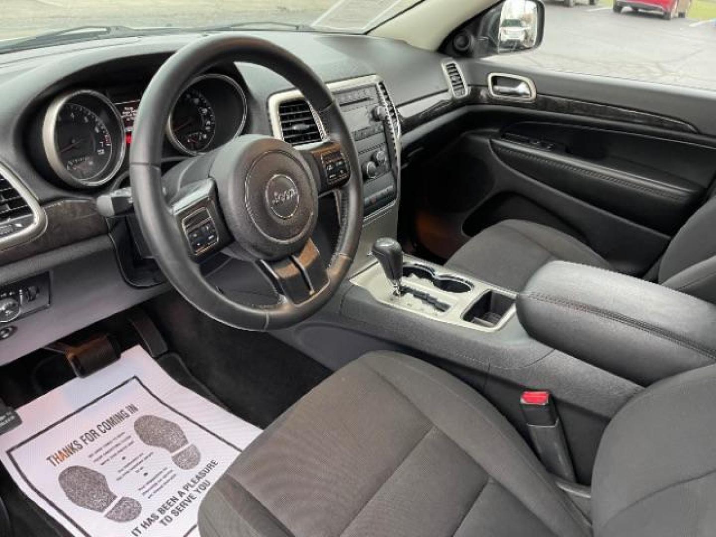 2011 Brilliant Black Crystal Pearl Jeep Grand Cherokee Laredo 4WD (1J4RR4GG4BC) with an 3.6L V6 DOHC 24V engine, 5-Speed Automatic transmission, located at 880 E. National Road, Vandalia, OH, 45377, (937) 908-9800, 39.891918, -84.183594 - Photo#6