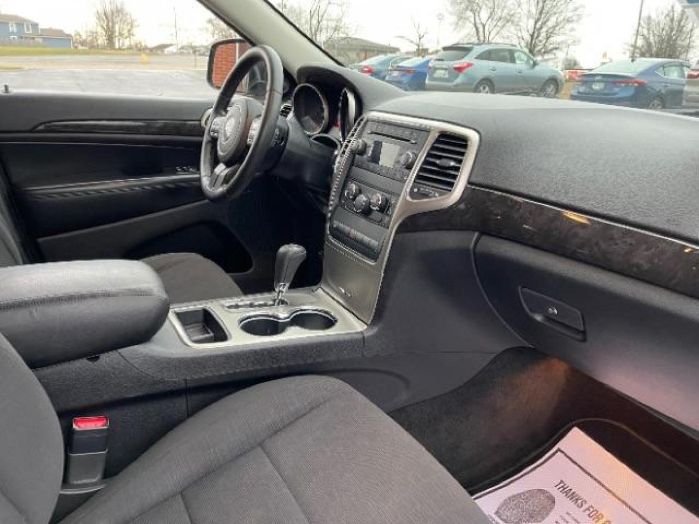 2011 Brilliant Black Crystal Pearl Jeep Grand Cherokee Laredo 4WD (1J4RR4GG4BC) with an 3.6L V6 DOHC 24V engine, 5-Speed Automatic transmission, located at 880 E. National Road, Vandalia, OH, 45377, (937) 908-9800, 39.891918, -84.183594 - Photo#7