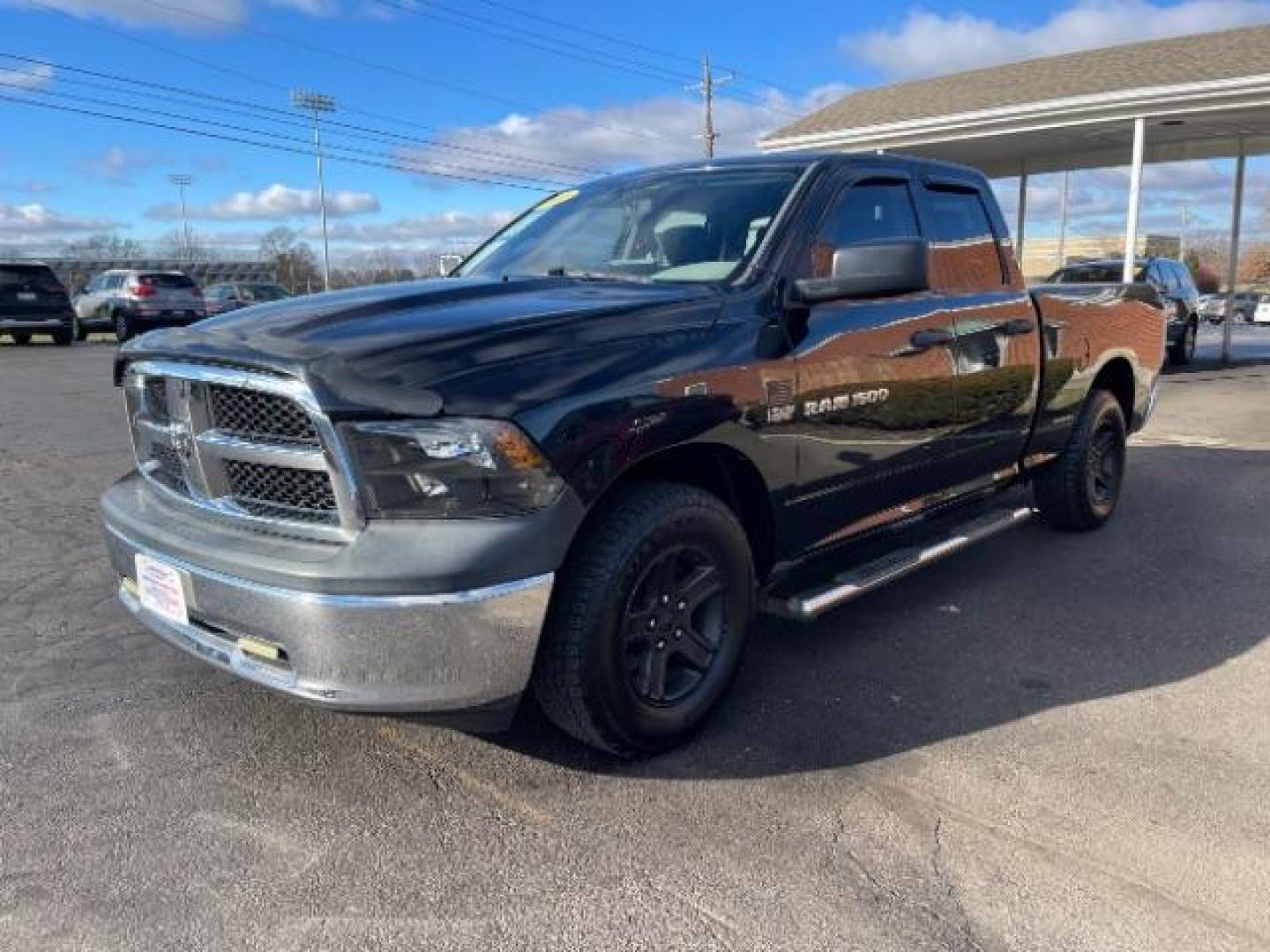 2011 Brilliant Black Crystal Pearl RAM 1500 Sport Quad Cab 4WD (1D7RV1GT2BS) with an 5.7L V8 OHV 16V engine, 5-Speed Automatic transmission, located at 401 Woodman Dr, Riverside, OH, 45431, (937) 908-9800, 39.760899, -84.123421 - Photo#1