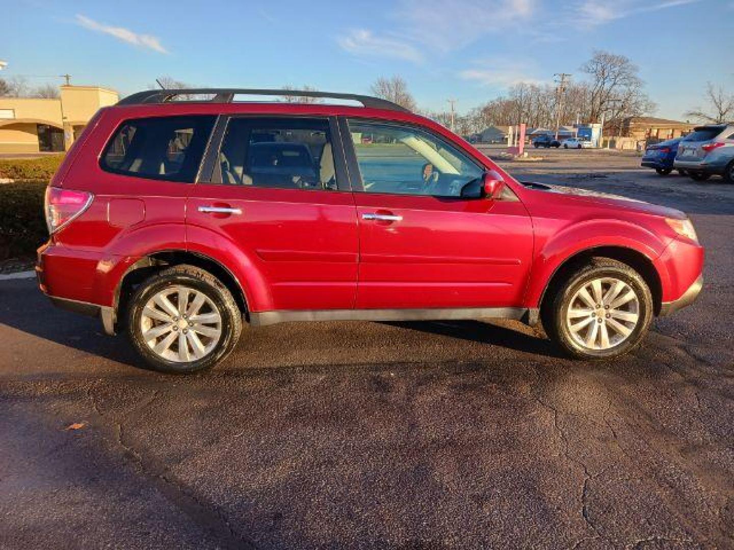 2011 Camellia Red Pearl Subaru Forester 2.5X Limited (JF2SHAEC2BH) with an 2.5L H4 SOHC 16V engine, 4-Speed Automatic transmission, located at 1230 East Main St, Xenia, OH, 45385, (937) 908-9800, 39.688026, -83.910172 - Photo#4