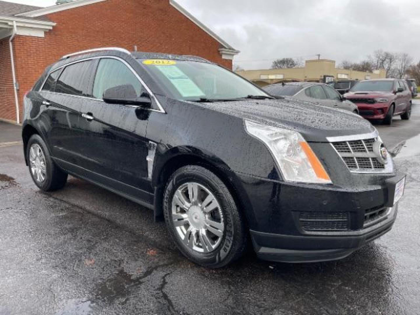 2012 Black Raven Cadillac SRX Luxury AWD (3GYFNDE35CS) with an 3.6L V6 DOHC 24V FFV engine, 6-Speed Automatic transmission, located at 1184 Kauffman Ave, Fairborn, OH, 45324, (937) 908-9800, 39.807072, -84.030914 - Photo#0