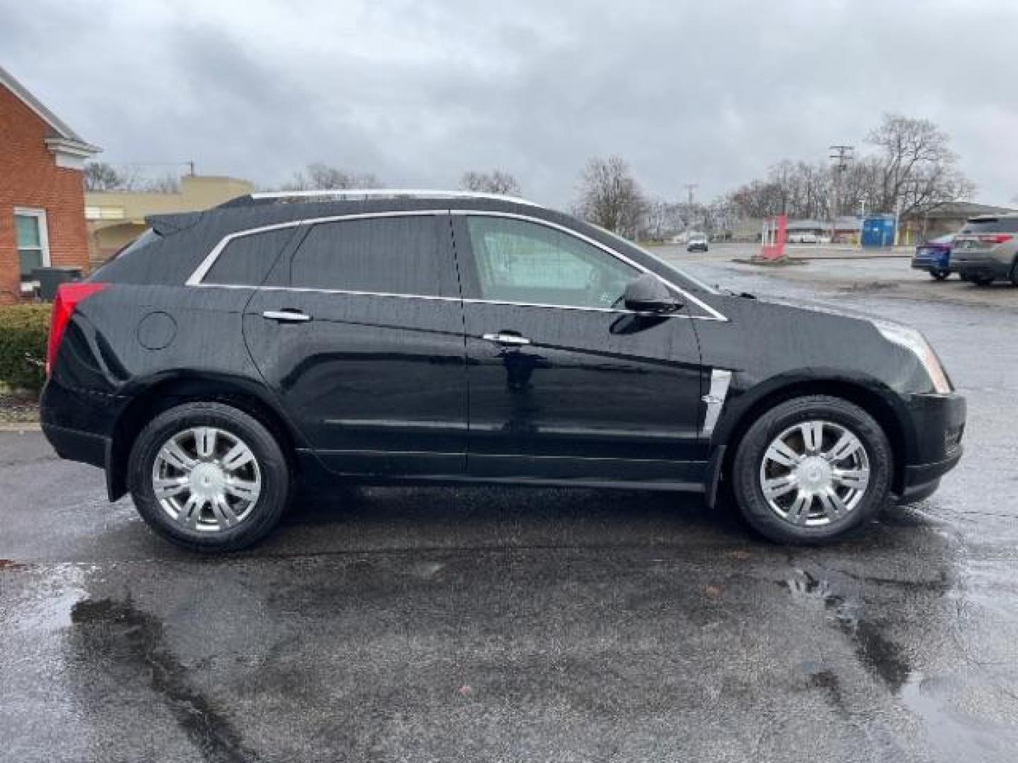 2012 Black Raven Cadillac SRX Luxury AWD (3GYFNDE35CS) with an 3.6L V6 DOHC 24V FFV engine, 6-Speed Automatic transmission, located at 1184 Kauffman Ave, Fairborn, OH, 45324, (937) 908-9800, 39.807072, -84.030914 - Photo#3