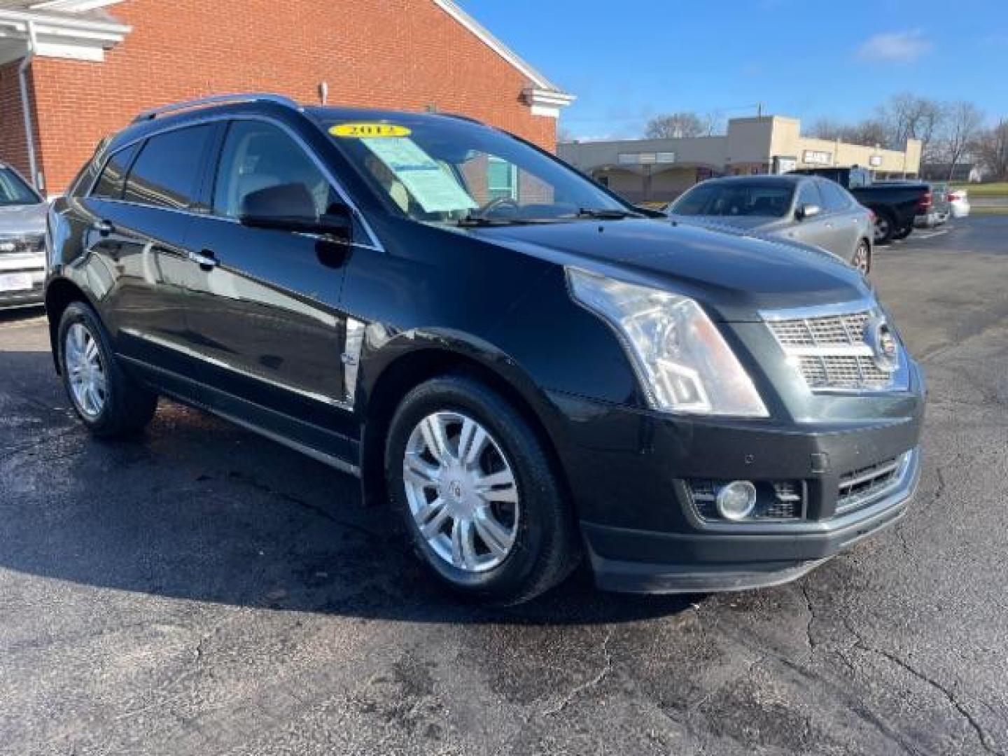 2012 Black Raven Cadillac SRX Luxury AWD (3GYFNDE34CS) with an 3.6L V6 DOHC 24V FFV engine, 6-Speed Automatic transmission, located at 1951 S Dayton Lakeview Rd., New Carlisle, OH, 45344, (937) 908-9800, 39.890999, -84.050255 - Photo#0