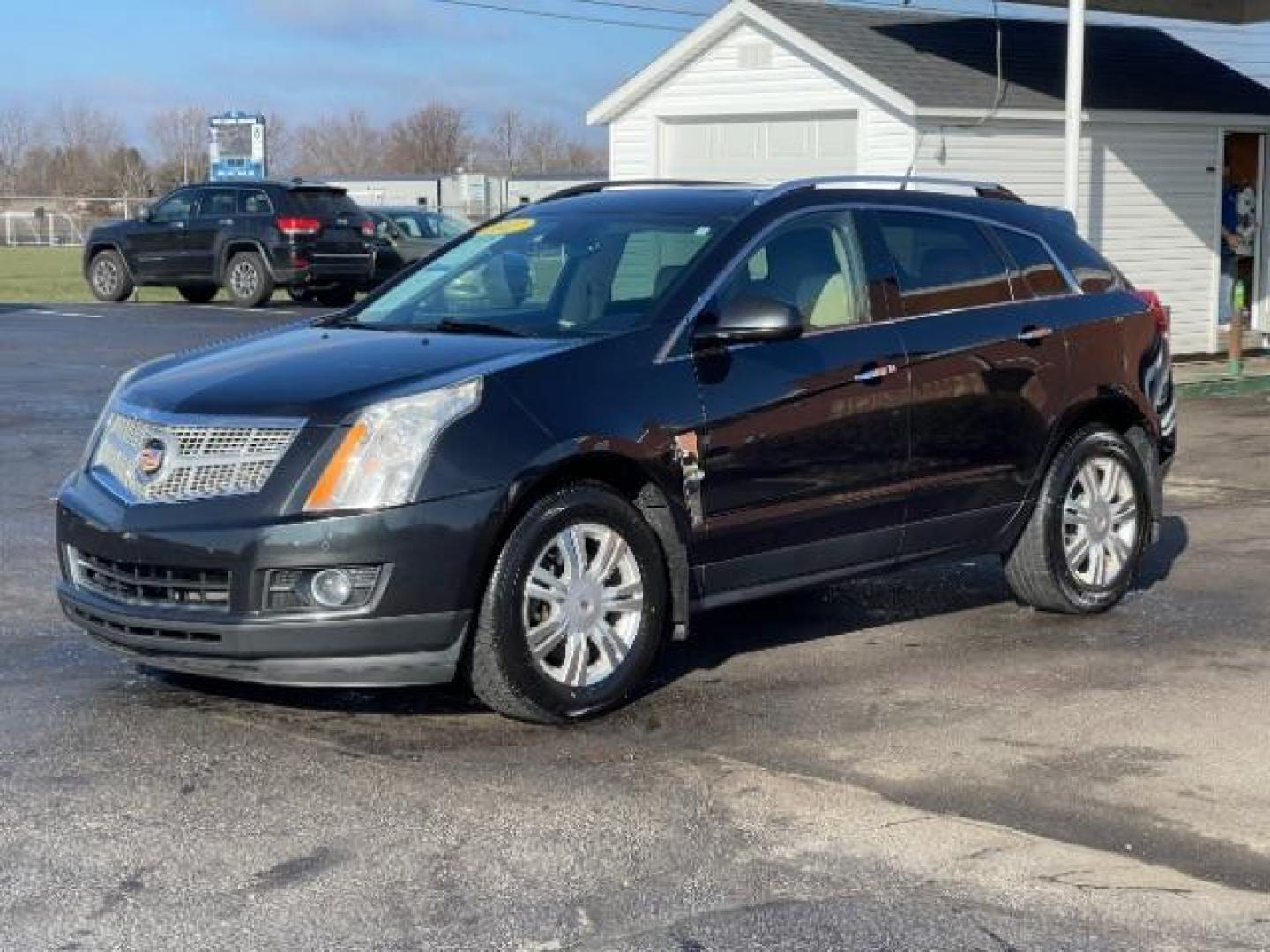 2012 Black Raven Cadillac SRX Luxury AWD (3GYFNDE34CS) with an 3.6L V6 DOHC 24V FFV engine, 6-Speed Automatic transmission, located at 1951 S Dayton Lakeview Rd., New Carlisle, OH, 45344, (937) 908-9800, 39.890999, -84.050255 - Photo#1