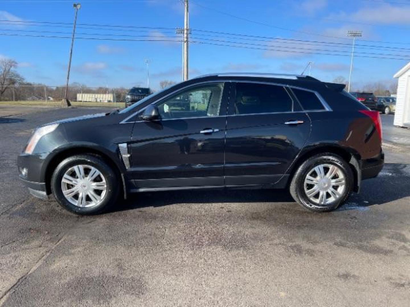 2012 Black Raven Cadillac SRX Luxury AWD (3GYFNDE34CS) with an 3.6L V6 DOHC 24V FFV engine, 6-Speed Automatic transmission, located at 1951 S Dayton Lakeview Rd., New Carlisle, OH, 45344, (937) 908-9800, 39.890999, -84.050255 - Photo#2