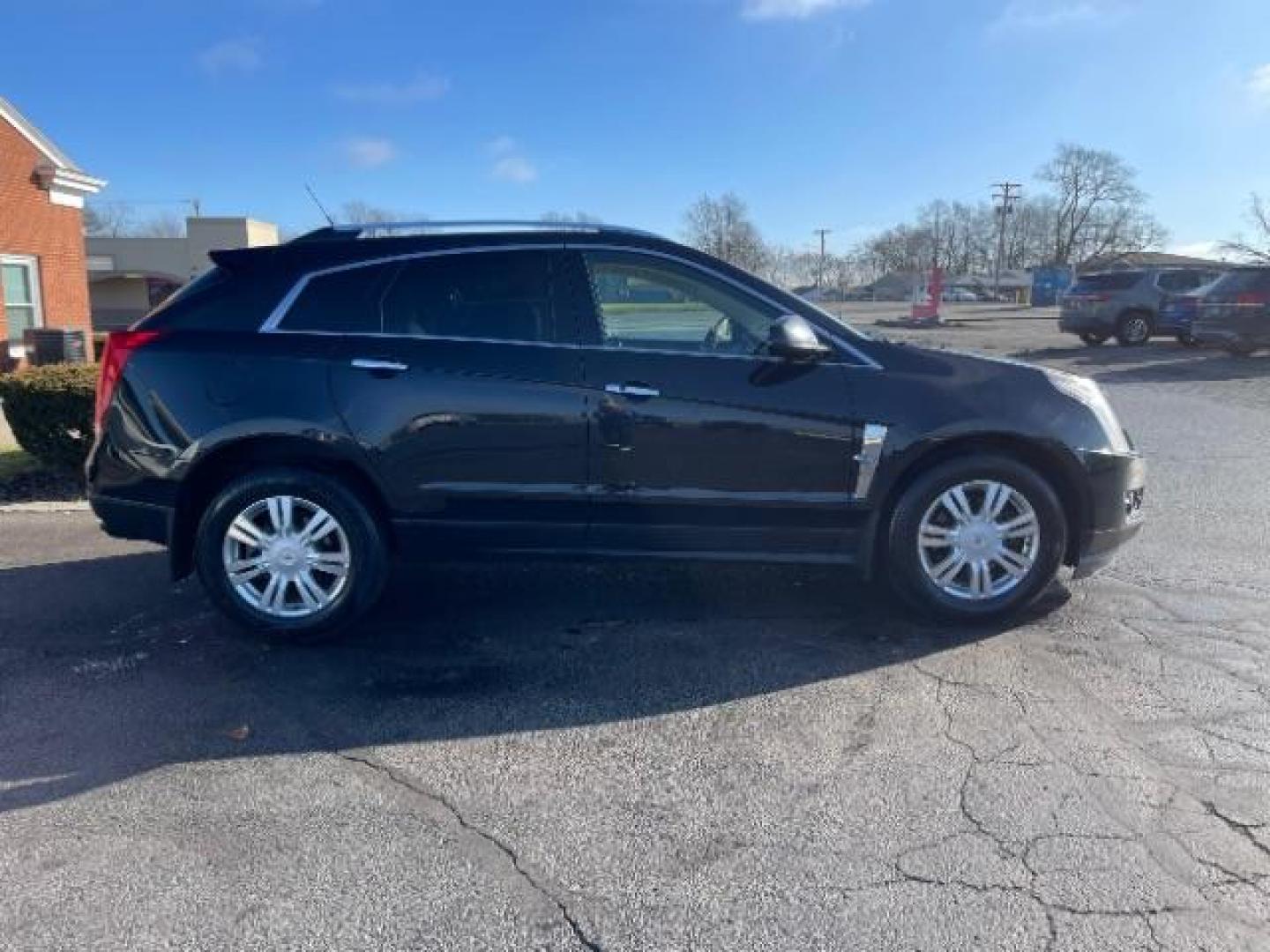 2012 Black Raven Cadillac SRX Luxury AWD (3GYFNDE34CS) with an 3.6L V6 DOHC 24V FFV engine, 6-Speed Automatic transmission, located at 1951 S Dayton Lakeview Rd., New Carlisle, OH, 45344, (937) 908-9800, 39.890999, -84.050255 - Photo#3