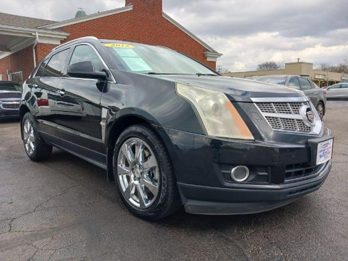 2012 Black Ice Metallic Cadillac SRX Premium AWD (3GYFNFE30CS) with an 3.6L V6 DOHC 24V FFV engine, 6-Speed Automatic transmission, located at 1230 East Main St, Xenia, OH, 45385, (937) 908-9800, 39.688026, -83.910172 - Photo#0