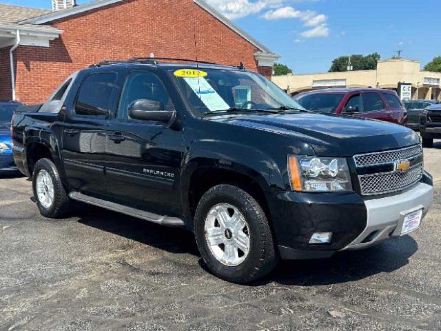 2012 Black Chevrolet Avalanche LT 4WD (3GNTKFE73CG) with an 5.3L V8 OHV 16V FFV engine, 4-Speed Automatic transmission, located at 1184 Kauffman Ave, Fairborn, OH, 45324, (937) 908-9800, 39.807072, -84.030914 - Photo#0