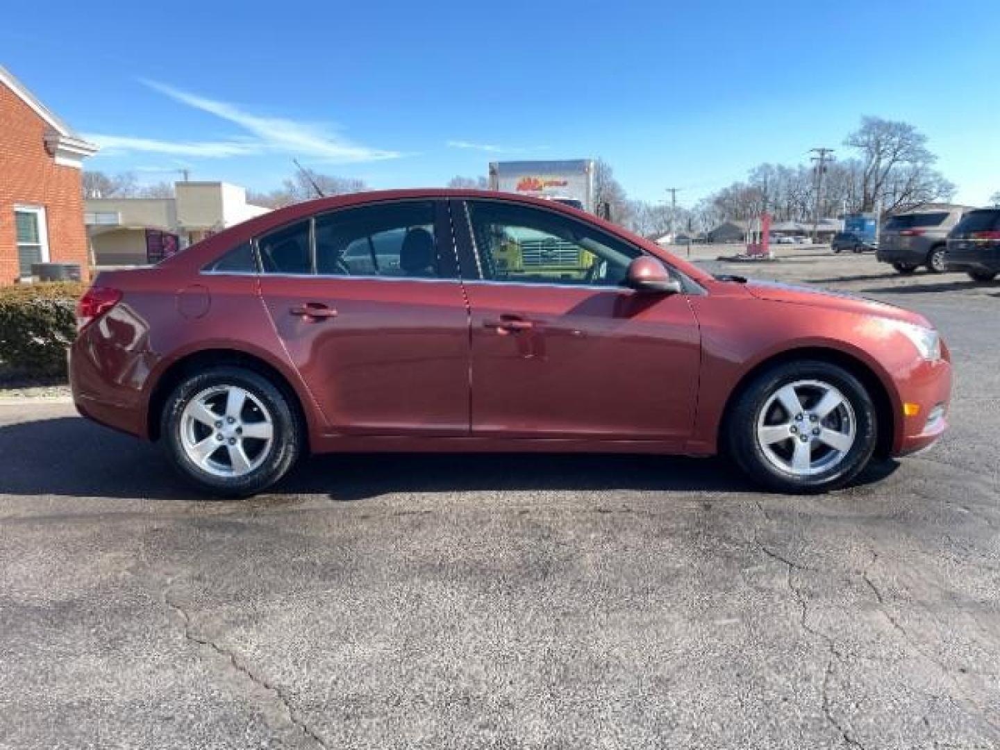 2012 Orange Chevrolet Cruze 1LT (1G1PF5SC6C7) with an 1.4L L4 DOHC 16V TURBO engine, 6-Speed Automatic transmission, located at 4508 South Dixie Dr, Moraine, OH, 45439, (937) 908-9800, 39.689976, -84.218452 - Photo#3