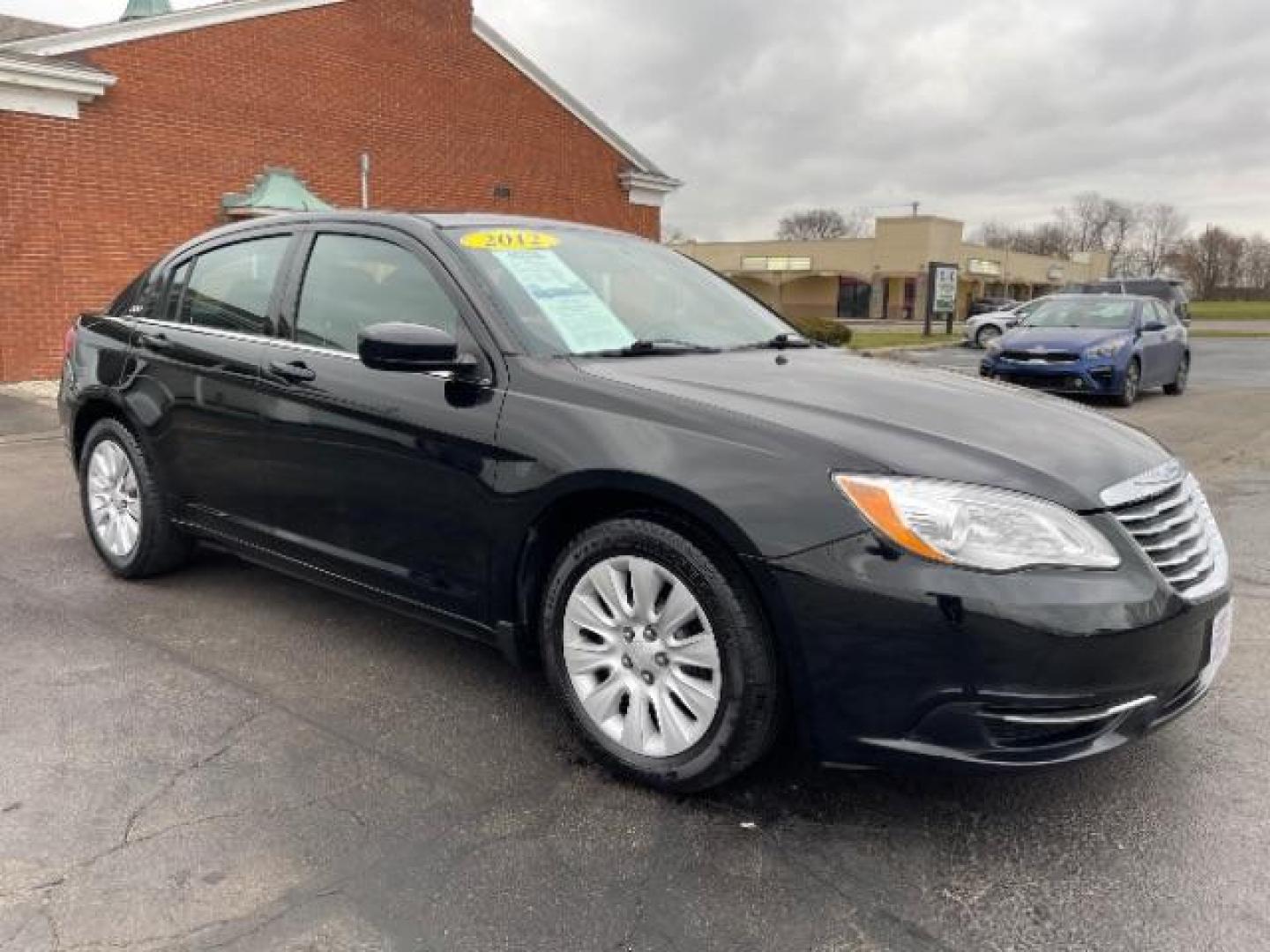 2012 Black Chrysler 200 LX (1C3CCBAB4CN) with an 2.4L L4 DOHC 16V engine, 6-Speed Automatic transmission, located at 880 E. National Road, Vandalia, OH, 45377, (937) 908-9800, 39.891918, -84.183594 - Photo#0