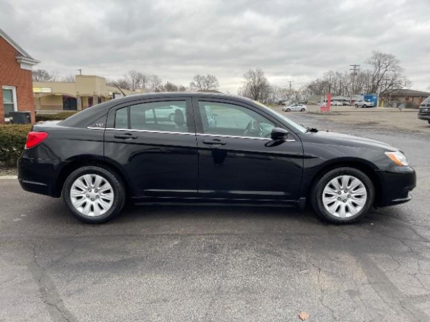 2012 Black Chrysler 200 LX (1C3CCBAB4CN) with an 2.4L L4 DOHC 16V engine, 6-Speed Automatic transmission, located at 880 E. National Road, Vandalia, OH, 45377, (937) 908-9800, 39.891918, -84.183594 - Photo#3