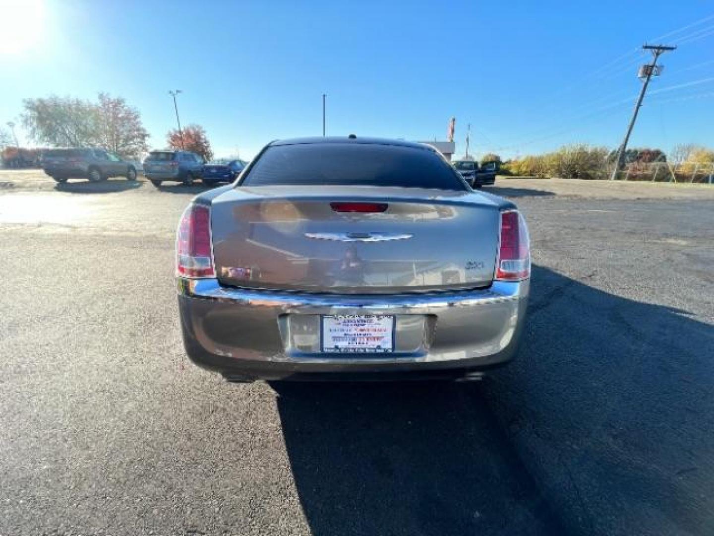 2012 Tungsten Metallic Chrysler 300 Base (2C3CCAAG9CH) with an 3.6L V6 SOHC 24V engine, 5-Speed Automatic transmission, located at 4508 South Dixie Dr, Moraine, OH, 45439, (937) 908-9800, 39.689976, -84.218452 - Photo#4