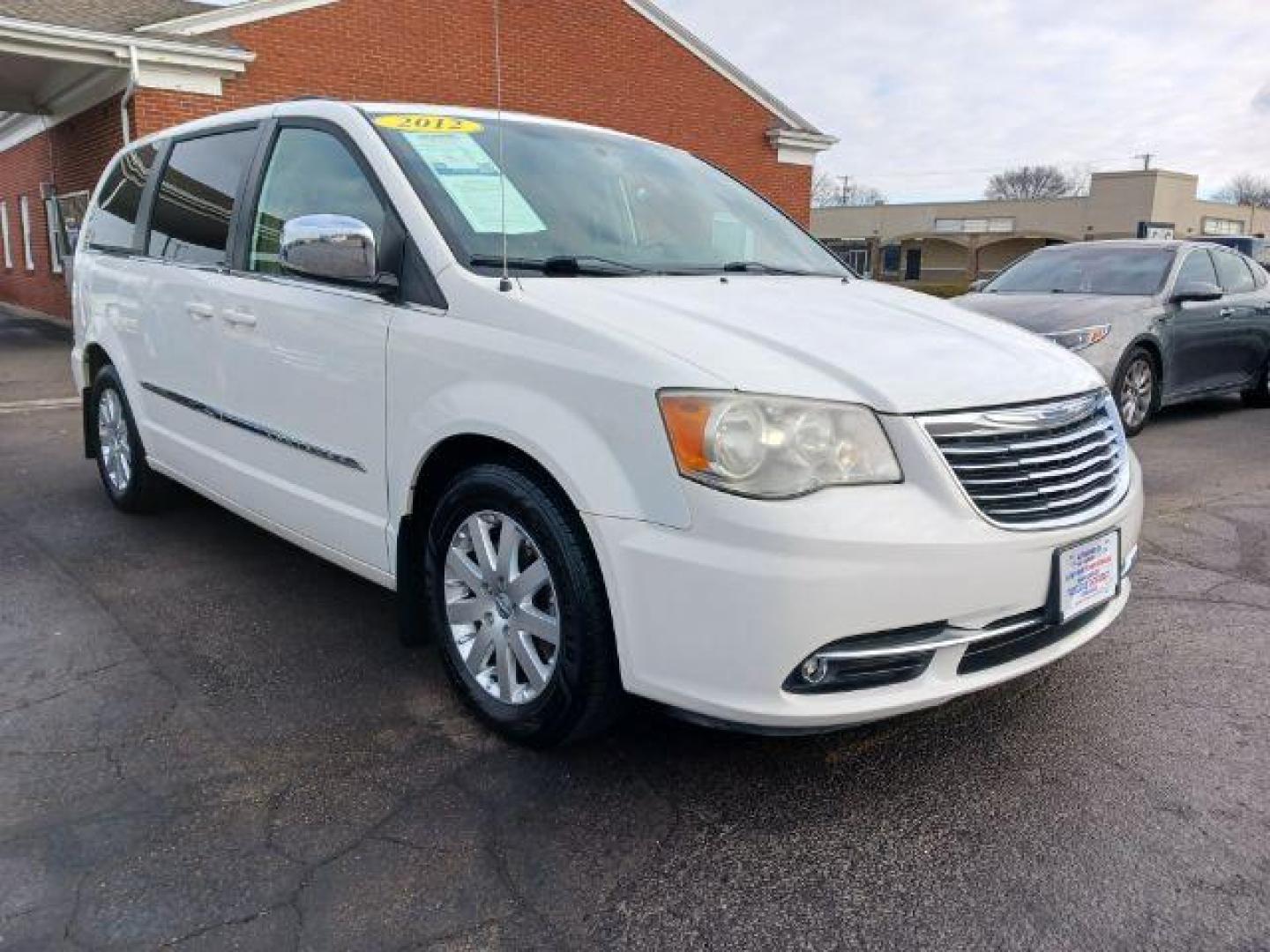 2012 Stone White Chrysler Town and Country Touring-L (2C4RC1CG4CR) with an 3.6L V6 DOHC 24V engine, 6-Speed Automatic transmission, located at 1099 N County Rd 25A, Troy, OH, 45373, (937) 908-9800, 40.057079, -84.212883 - Photo#0