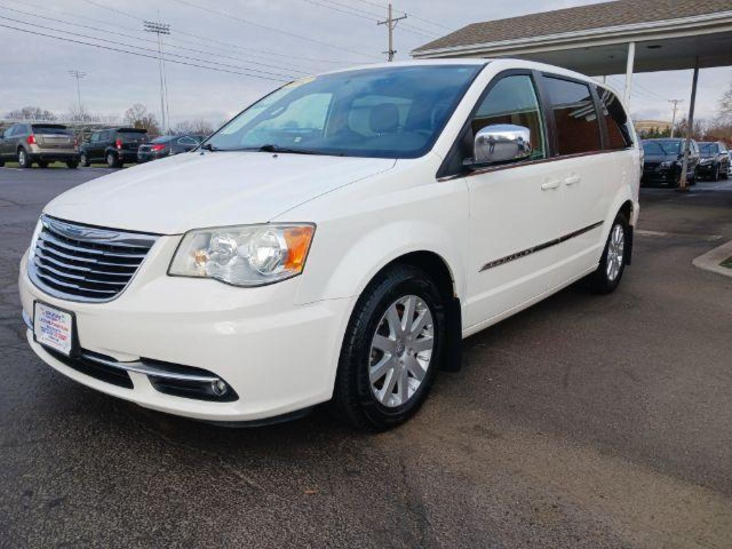 2012 Stone White Chrysler Town and Country Touring-L (2C4RC1CG4CR) with an 3.6L V6 DOHC 24V engine, 6-Speed Automatic transmission, located at 1099 N County Rd 25A, Troy, OH, 45373, (937) 908-9800, 40.057079, -84.212883 - Photo#2