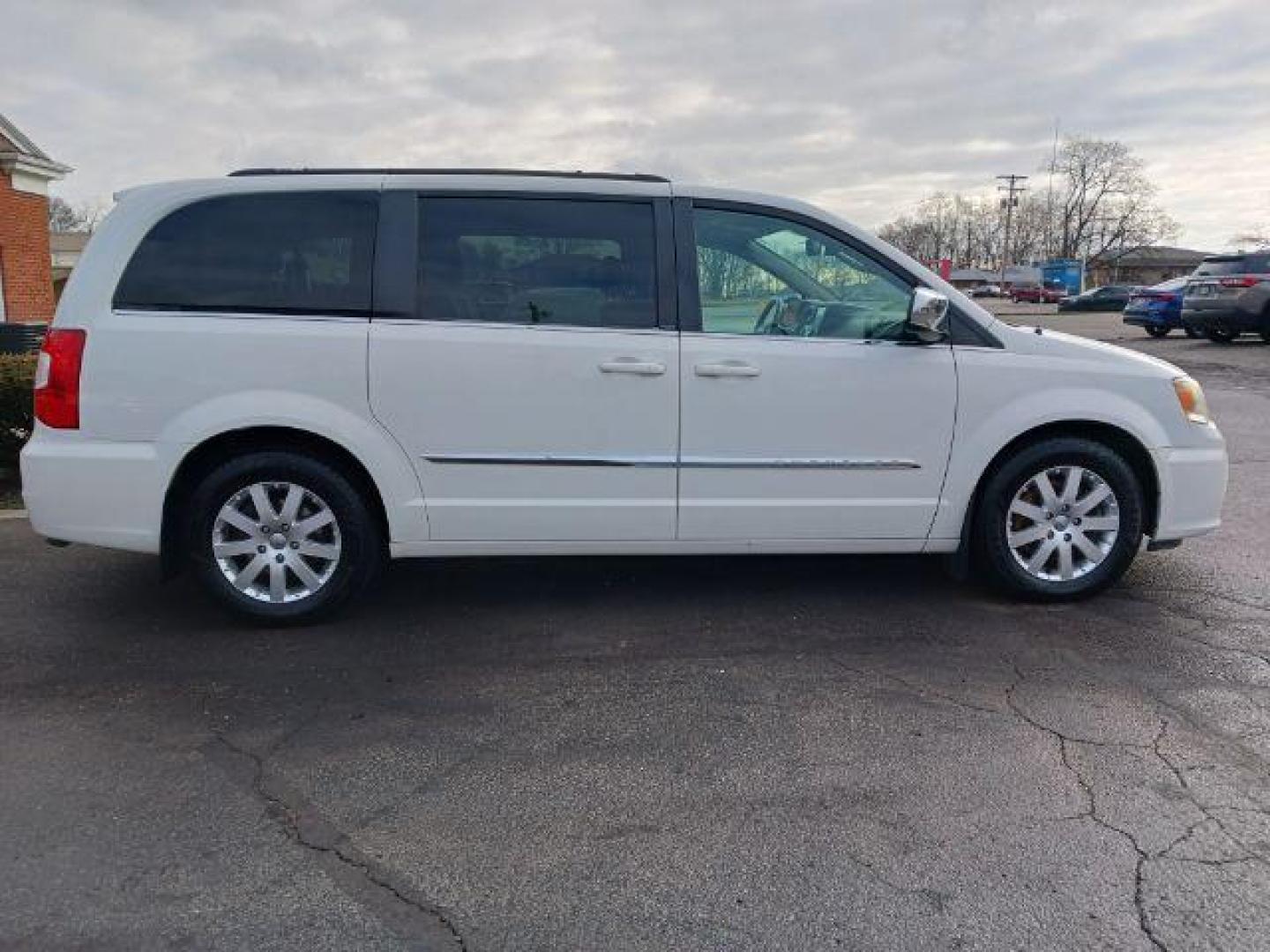 2012 Stone White Chrysler Town and Country Touring-L (2C4RC1CG4CR) with an 3.6L V6 DOHC 24V engine, 6-Speed Automatic transmission, located at 1099 N County Rd 25A, Troy, OH, 45373, (937) 908-9800, 40.057079, -84.212883 - Photo#4