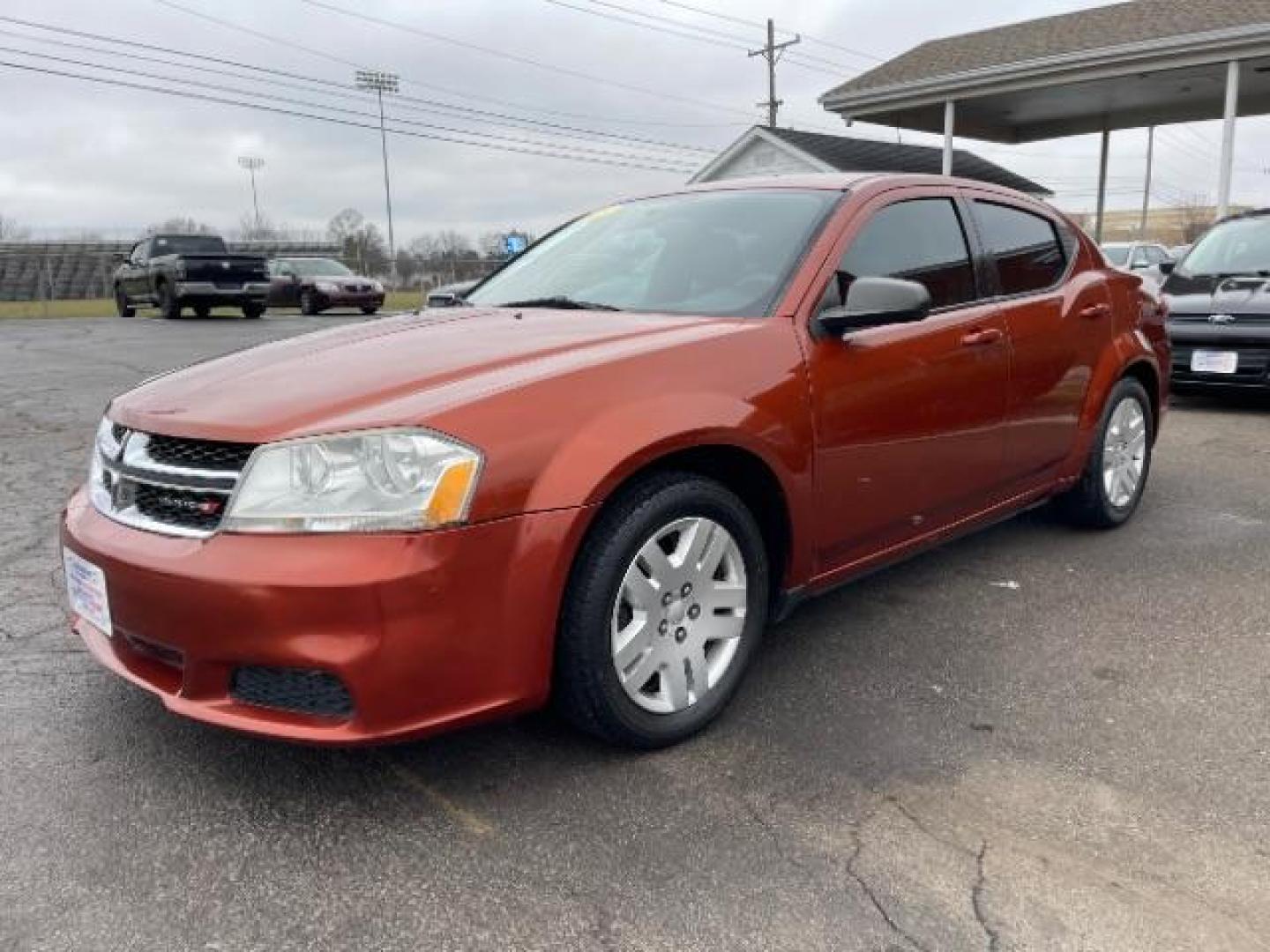 2012 Orange Dodge Avenger Base (1C3CDZAB1CN) with an 2.4L L4 DOHC 16V engine, 4-Speed Automatic transmission, located at 4508 South Dixie Dr, Moraine, OH, 45439, (937) 908-9800, 39.689976, -84.218452 - Photo#1