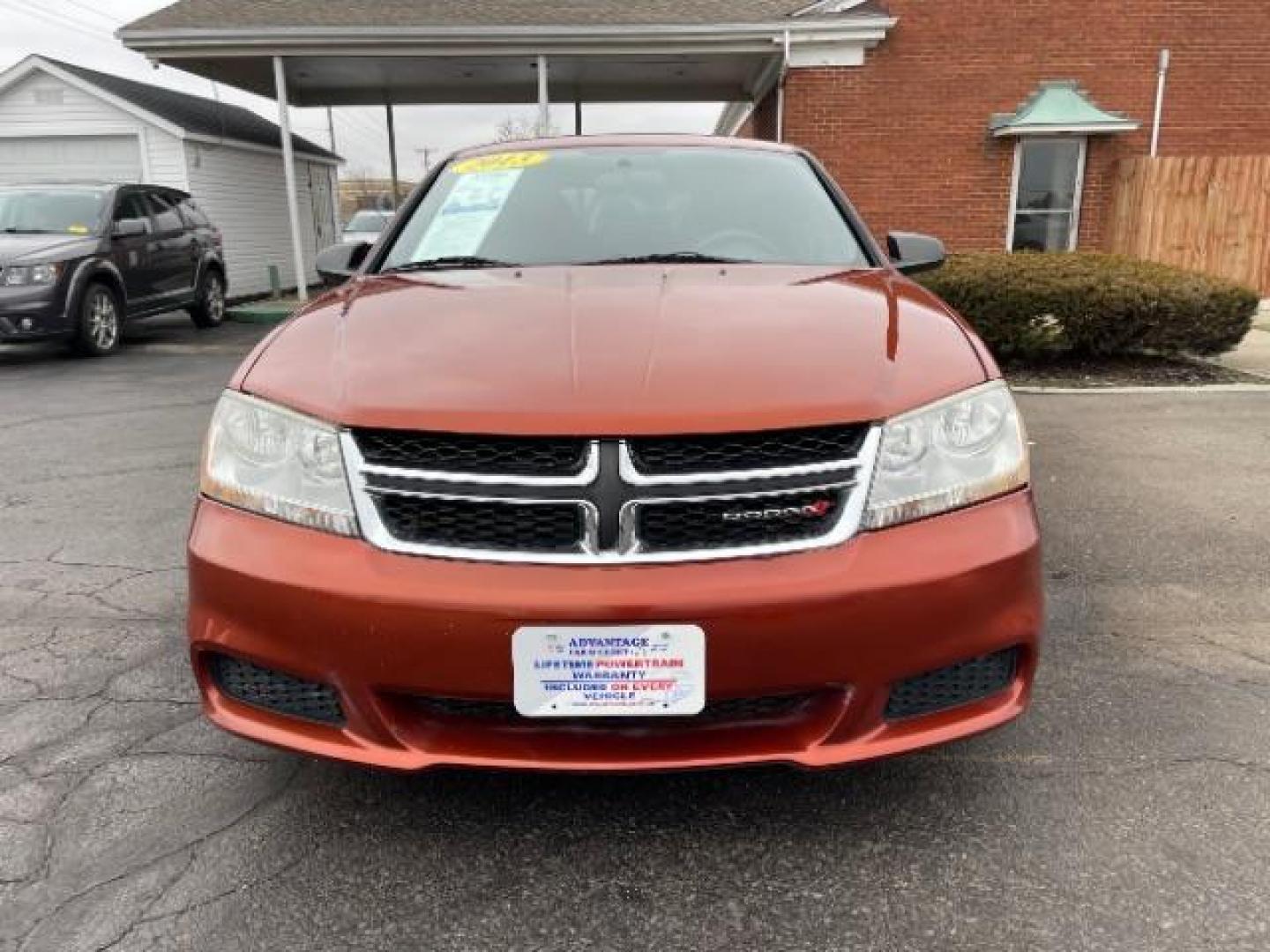 2012 Orange Dodge Avenger Base (1C3CDZAB1CN) with an 2.4L L4 DOHC 16V engine, 4-Speed Automatic transmission, located at 4508 South Dixie Dr, Moraine, OH, 45439, (937) 908-9800, 39.689976, -84.218452 - Photo#5