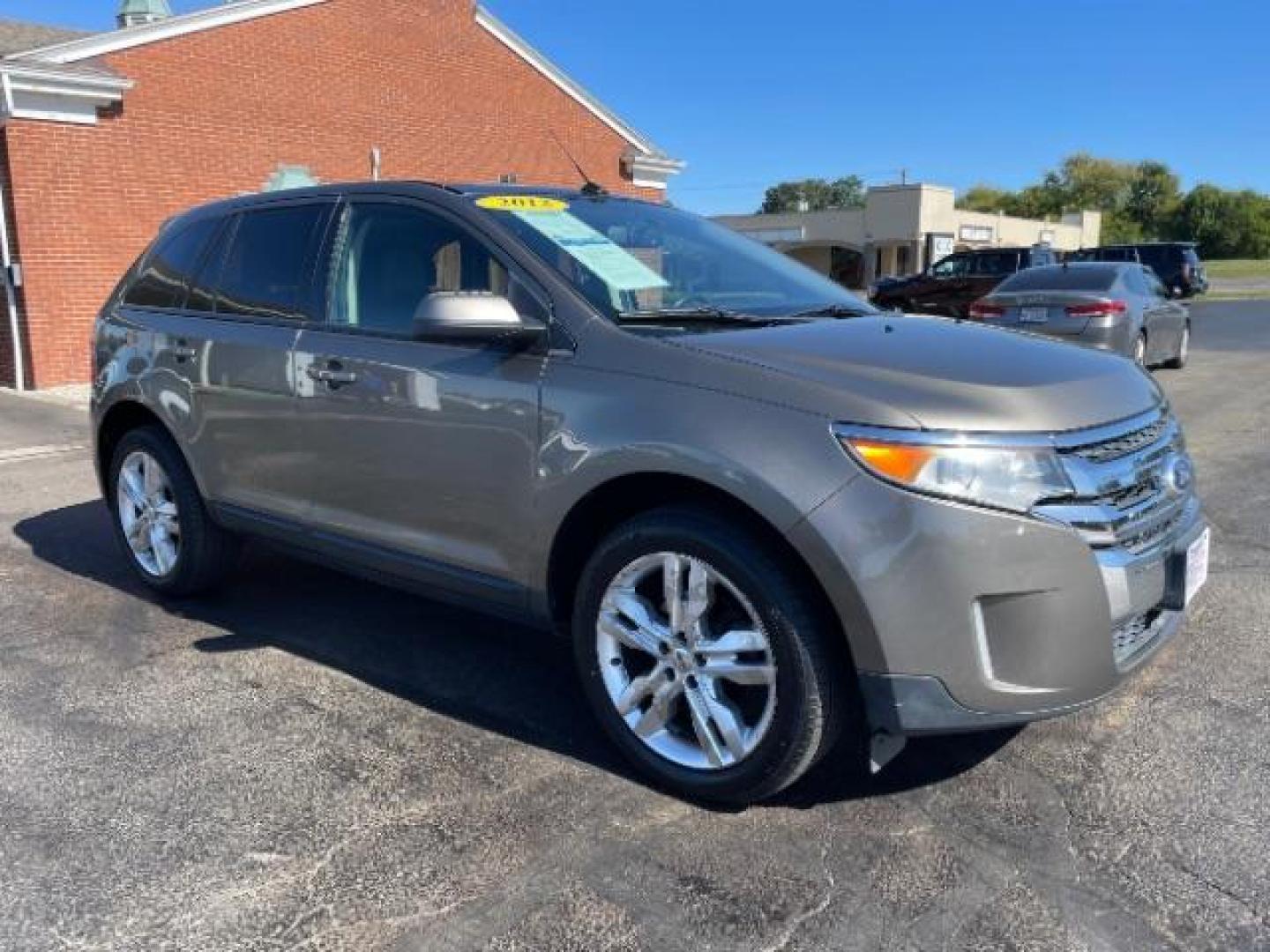 2012 Ginger Ale Metallic Ford Edge SEL FWD (2FMDK3JCXCB) with an 3.5L V6 DOHC 24V engine, 6-Speed Automatic transmission, located at 880 E. National Road, Vandalia, OH, 45377, (937) 908-9800, 39.891918, -84.183594 - Photo#0