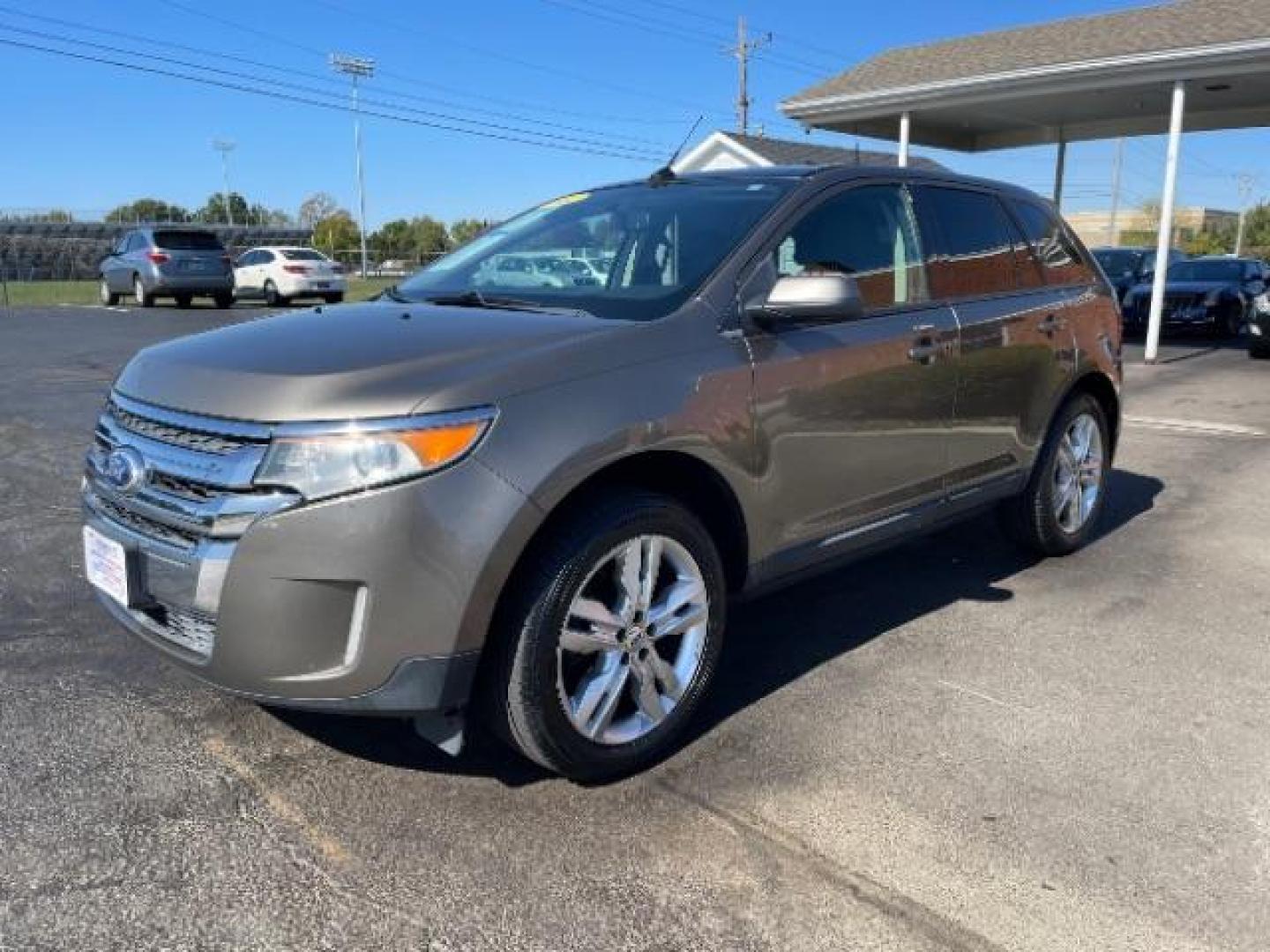 2012 Ginger Ale Metallic Ford Edge SEL FWD (2FMDK3JCXCB) with an 3.5L V6 DOHC 24V engine, 6-Speed Automatic transmission, located at 880 E. National Road, Vandalia, OH, 45377, (937) 908-9800, 39.891918, -84.183594 - Photo#1