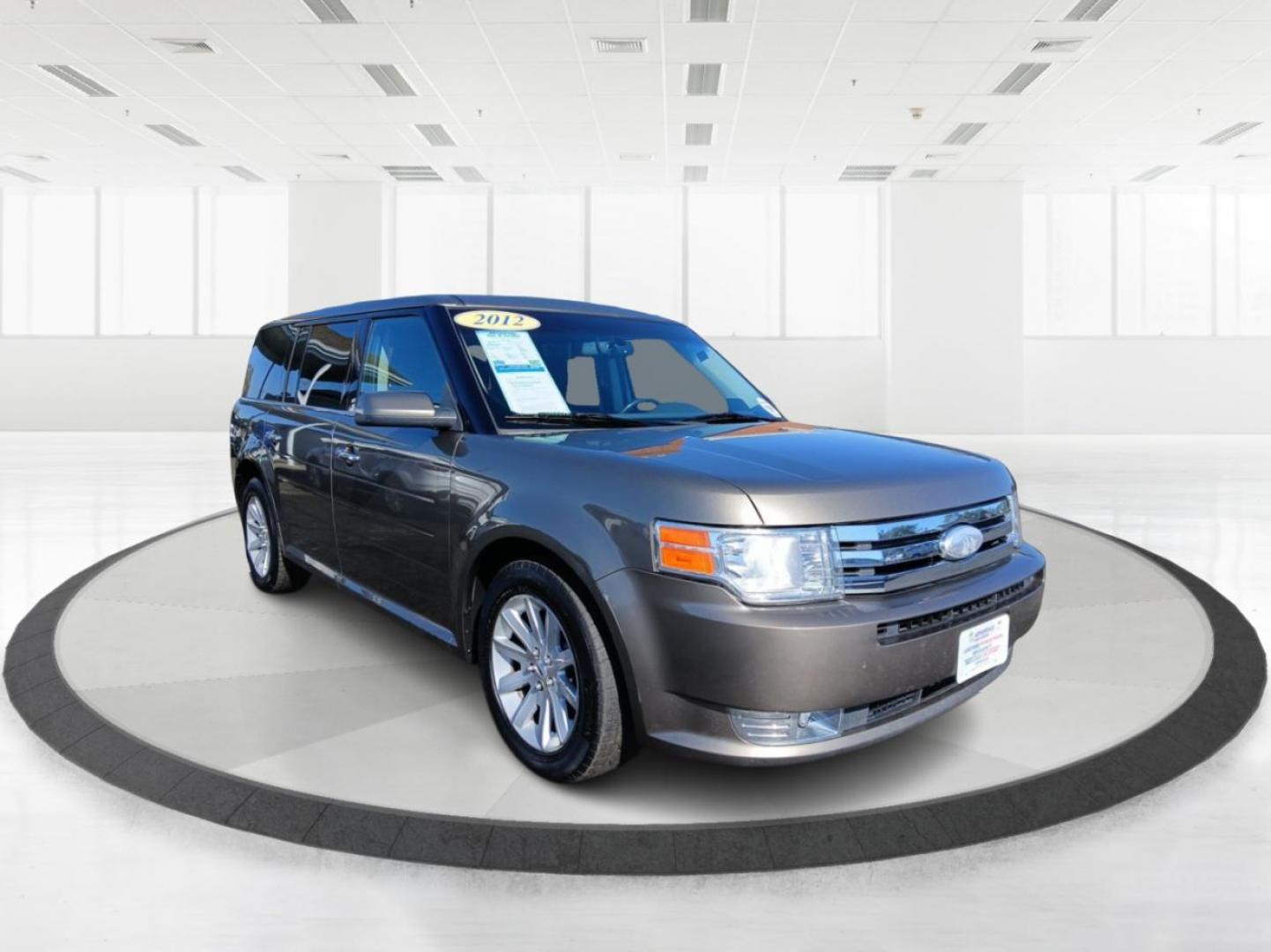 2012 Mineral Gray Metallic Ford Flex SEL FWD (2FMGK5CC2CB) with an 3.5L V6 DOHC 24V engine, 6-Speed Automatic Overdrive transmission, located at 1951 S Dayton Lakeview Rd., New Carlisle, OH, 45344, (937) 908-9800, 39.890999, -84.050255 - Photo#0