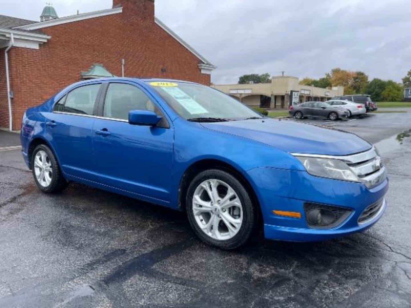 2012 Blue Flame Metallic Ford Fusion SE (3FAHP0HG6CR) with an 3.0L V6 DOHC 24V engine, located at 401 Woodman Dr, Riverside, OH, 45431, (937) 908-9800, 39.760899, -84.123421 - Photo#0