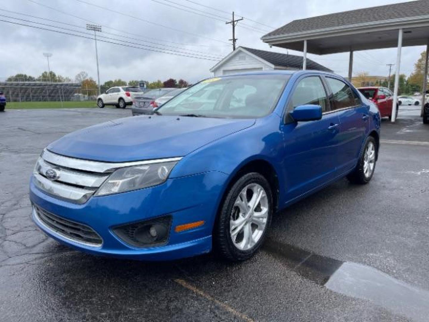 2012 Blue Flame Metallic Ford Fusion SE (3FAHP0HG6CR) with an 3.0L V6 DOHC 24V engine, located at 401 Woodman Dr, Riverside, OH, 45431, (937) 908-9800, 39.760899, -84.123421 - Photo#1