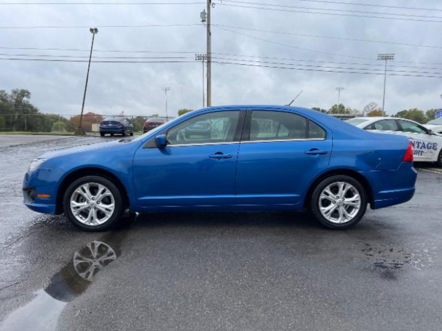 2012 Blue Flame Metallic Ford Fusion SE (3FAHP0HG6CR) with an 3.0L V6 DOHC 24V engine, located at 401 Woodman Dr, Riverside, OH, 45431, (937) 908-9800, 39.760899, -84.123421 - Photo#5