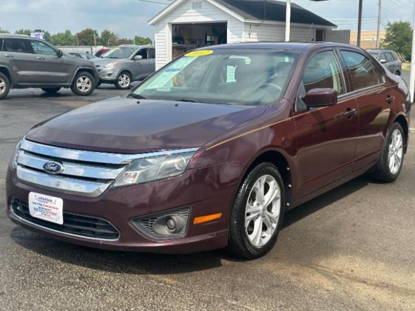 2012 Cinnamon Metallic Ford Fusion SE (3FAHP0HA1CR) with an 2.5L L4 DOHC 16V engine, located at 1230 East Main St, Xenia, OH, 45385, (937) 908-9800, 39.688026, -83.910172 - Photo#2