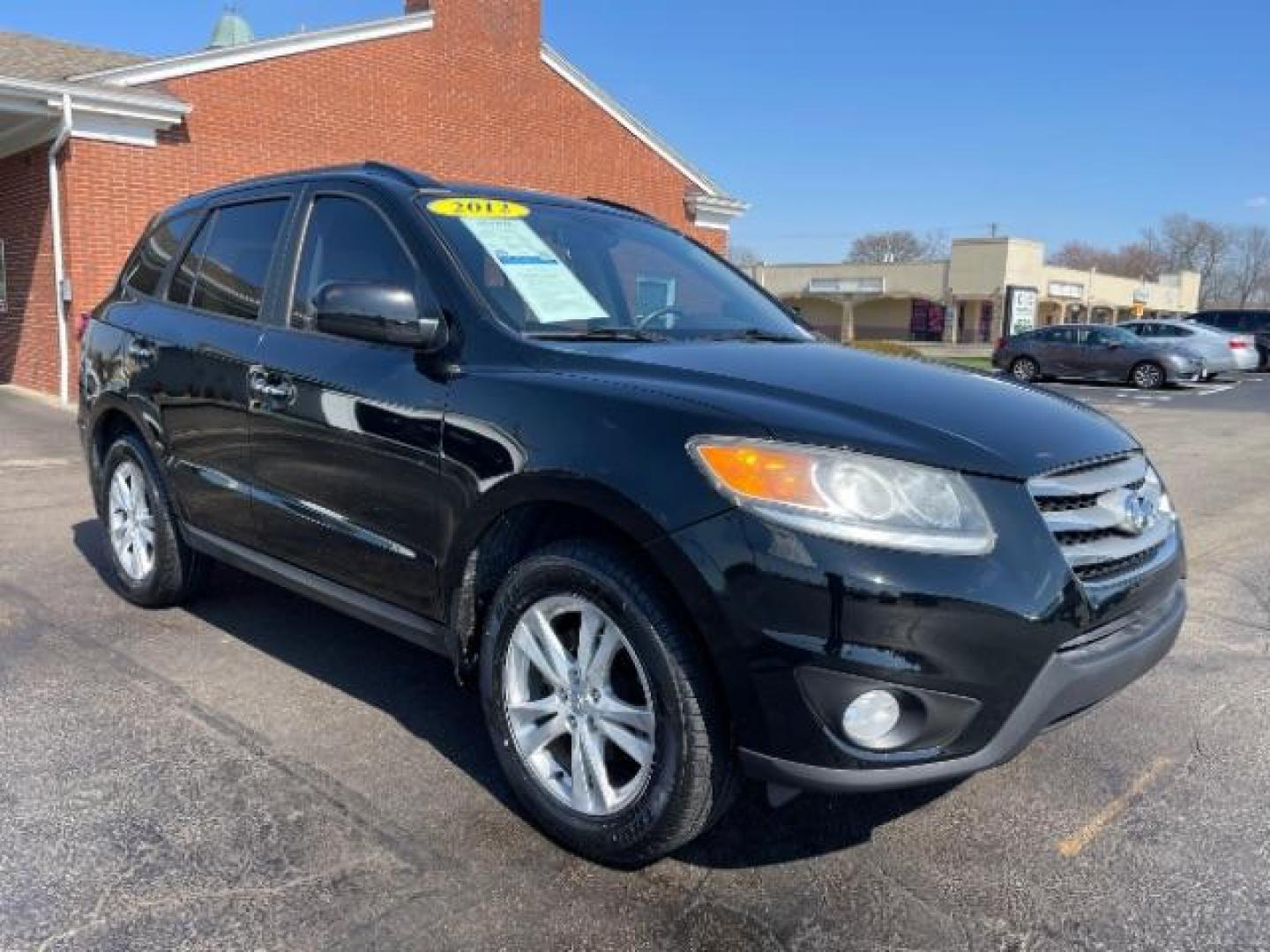 2012 Twilight Black Hyundai Santa Fe Limited 2.4 FWD (5XYZK3AB2CG) with an 2.4L L4 DOHC 16V engine, 6-Speed Automatic transmission, located at 880 E. National Road, Vandalia, OH, 45377, (937) 908-9800, 39.891918, -84.183594 - Photo#0