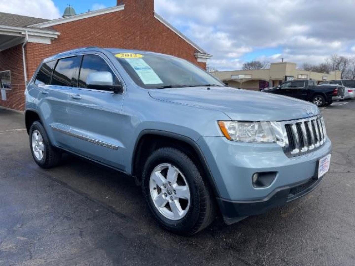 2012 True Blue Pearl Jeep Grand Cherokee Laredo 4WD (1C4RJFAG7CC) with an 3.6L V6 DOHC 24V engine, 5-Speed Automatic transmission, located at 1099 N County Rd 25A, Troy, OH, 45373, (937) 908-9800, 40.057079, -84.212883 - Photo#0