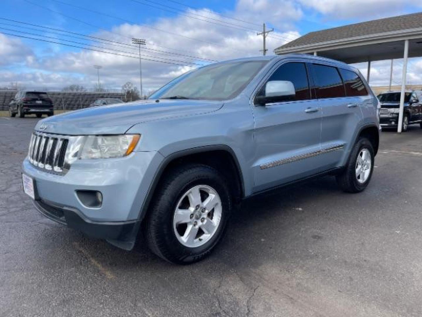 2012 True Blue Pearl Jeep Grand Cherokee Laredo 4WD (1C4RJFAG7CC) with an 3.6L V6 DOHC 24V engine, 5-Speed Automatic transmission, located at 1099 N County Rd 25A, Troy, OH, 45373, (937) 908-9800, 40.057079, -84.212883 - Photo#1