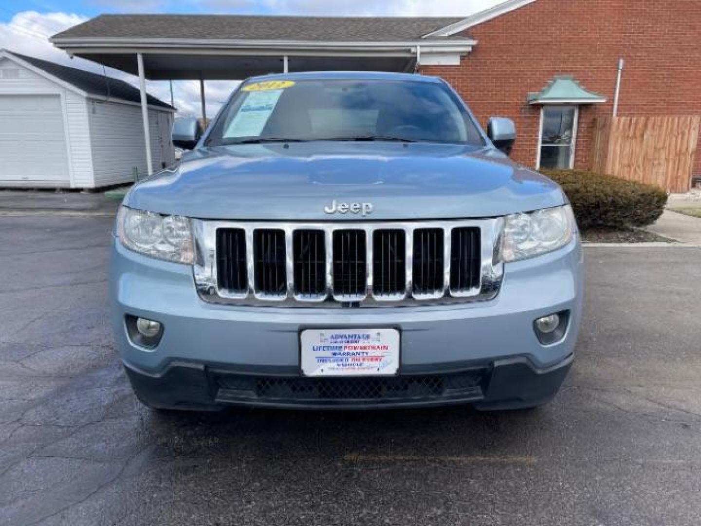 2012 True Blue Pearl Jeep Grand Cherokee Laredo 4WD (1C4RJFAG7CC) with an 3.6L V6 DOHC 24V engine, 5-Speed Automatic transmission, located at 1099 N County Rd 25A, Troy, OH, 45373, (937) 908-9800, 40.057079, -84.212883 - Photo#4