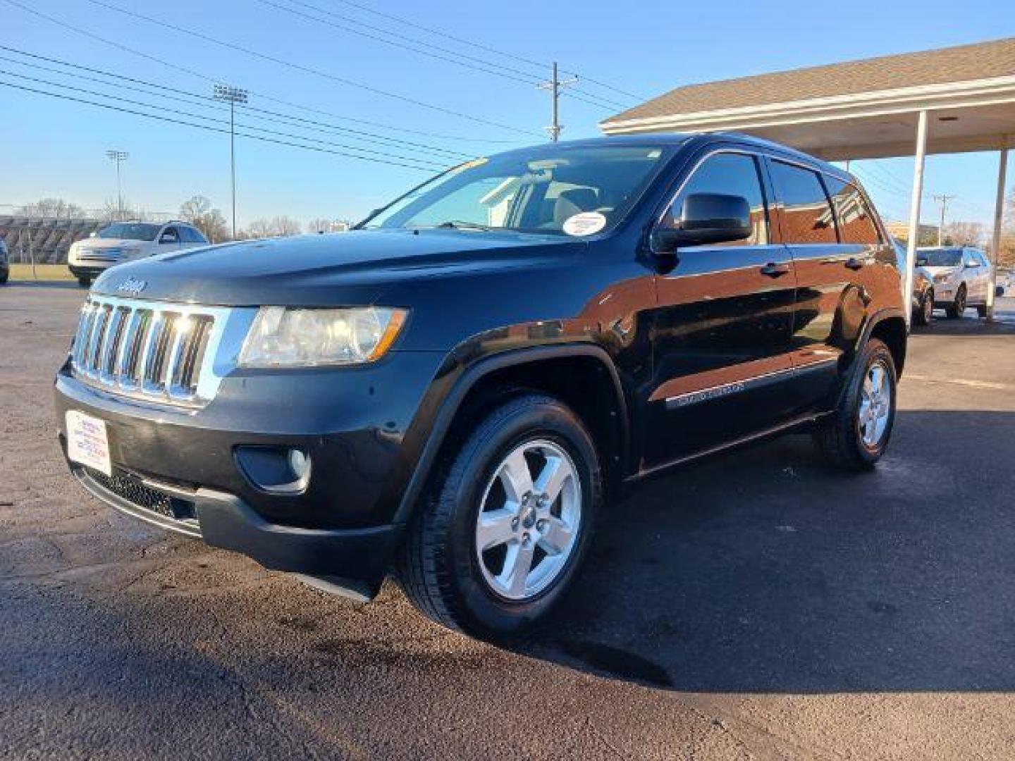 2012 Brilliant Black Crystal Pearl Jeep Grand Cherokee Laredo 4WD (1C4RJFAG1CC) with an 3.6L V6 DOHC 24V engine, 5-Speed Automatic transmission, located at 1099 N County Rd 25A, Troy, OH, 45373, (937) 908-9800, 40.057079, -84.212883 - Photo#2