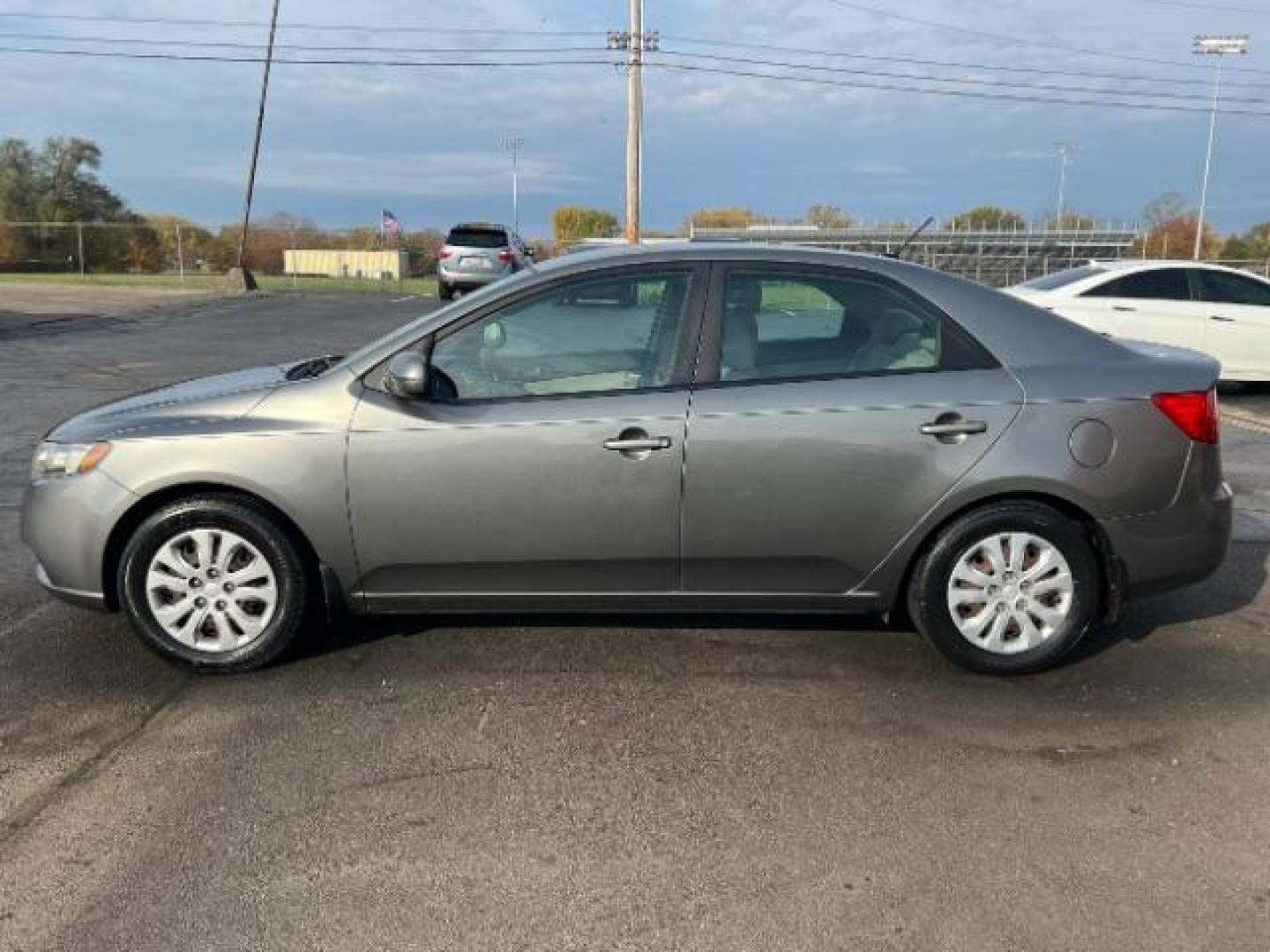 2012 Metal Bronze Metallic Kia Forte EX (KNAFU4A24C5) with an 2.0L L4 DOHC 16V engine, located at 1099 N County Rd 25A, Troy, OH, 45373, (937) 908-9800, 40.057079, -84.212883 - Photo#2