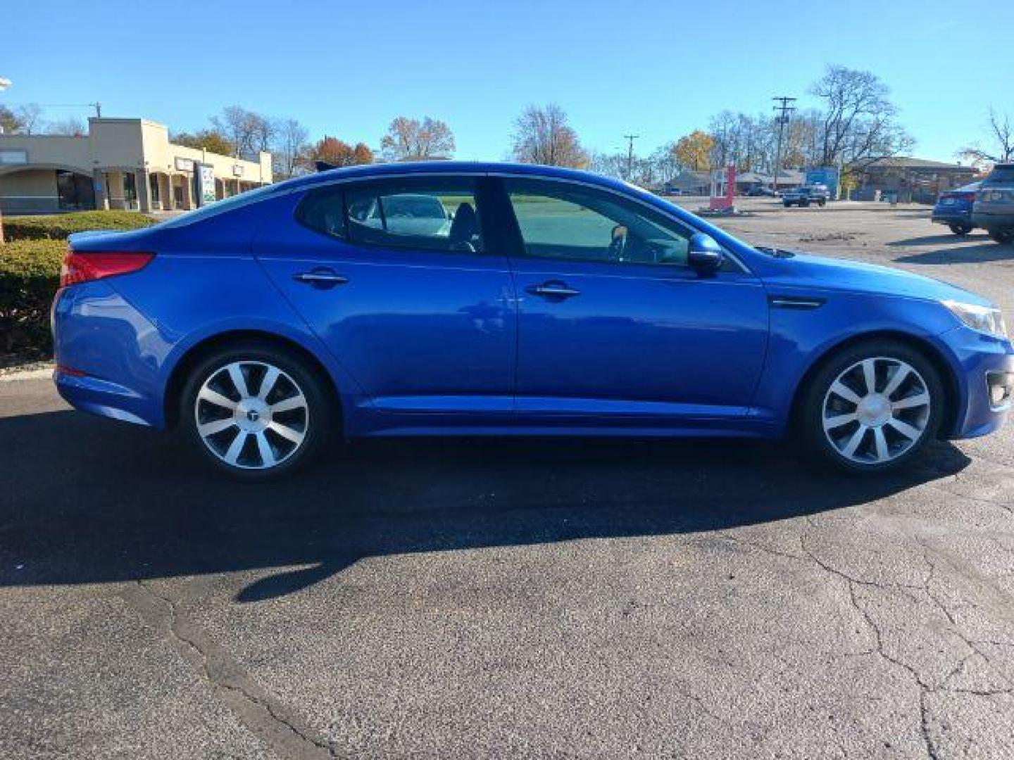 2012 Corsa Blue Pearl Metallic Kia Optima SX (5XXGR4A67CG) with an 2.0L L4 DOHC 16V TURBO engine, 6-Speed Automatic transmission, located at 1184 Kauffman Ave, Fairborn, OH, 45324, (937) 908-9800, 39.807072, -84.030914 - Photo#4