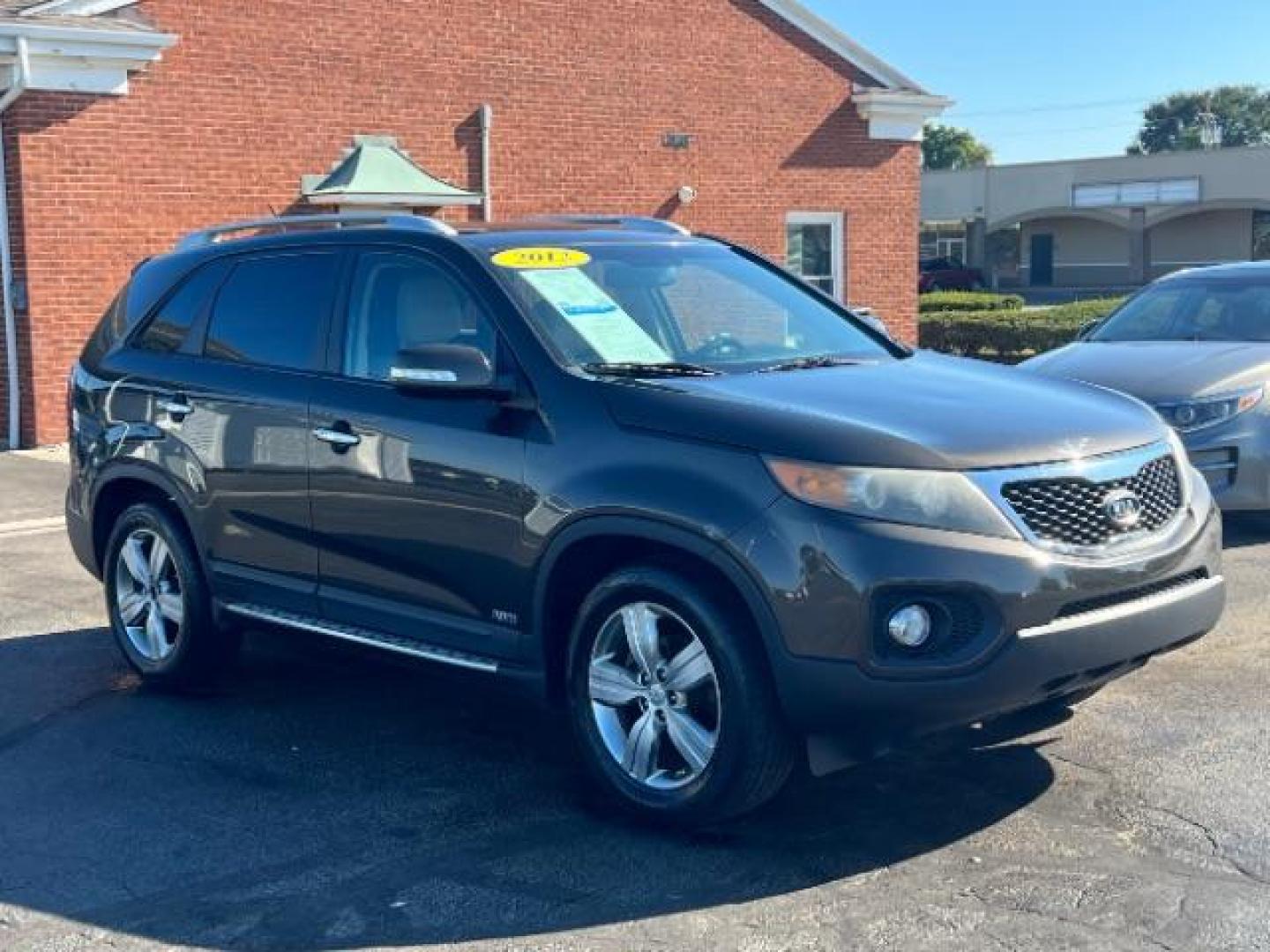 2012 Java Brown Kia Sorento EX 4WD (5XYKUDA68CG) with an 2.4L L4 DOHC 16V engine, 6-Speed Automatic transmission, located at 4508 South Dixie Dr, Moraine, OH, 45439, (937) 908-9800, 39.689976, -84.218452 - Photo#0