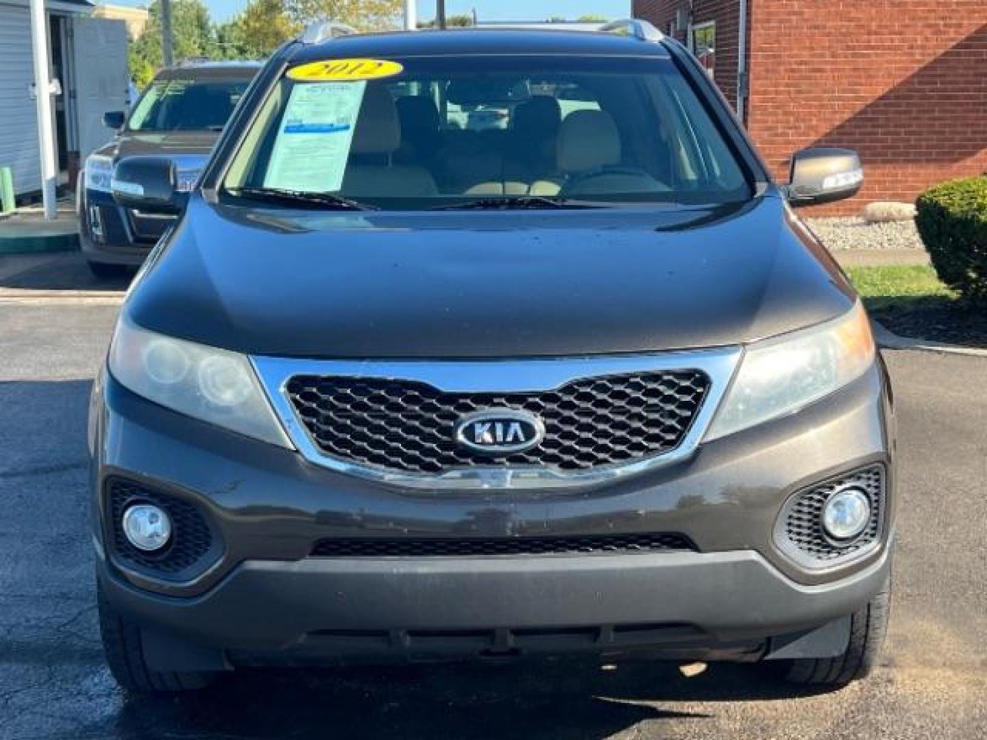 2012 Java Brown Kia Sorento EX 4WD (5XYKUDA68CG) with an 2.4L L4 DOHC 16V engine, 6-Speed Automatic transmission, located at 4508 South Dixie Dr, Moraine, OH, 45439, (937) 908-9800, 39.689976, -84.218452 - Photo#1