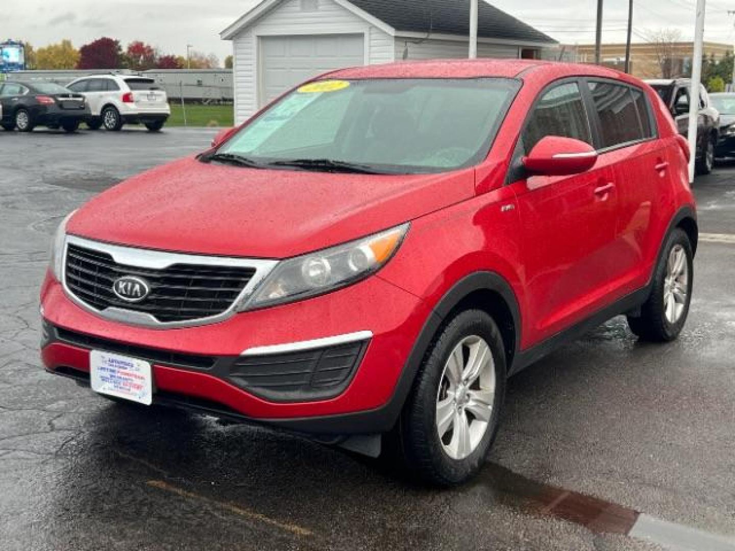 2012 Signal Red Metallic Kia Sportage LX AWD (KNDPBCA27C7) with an 2.4L V6 DOHC 24V engine, 6-Speed Automatic transmission, located at 1230 East Main St, Xenia, OH, 45385, (937) 908-9800, 39.688026, -83.910172 - Photo#2